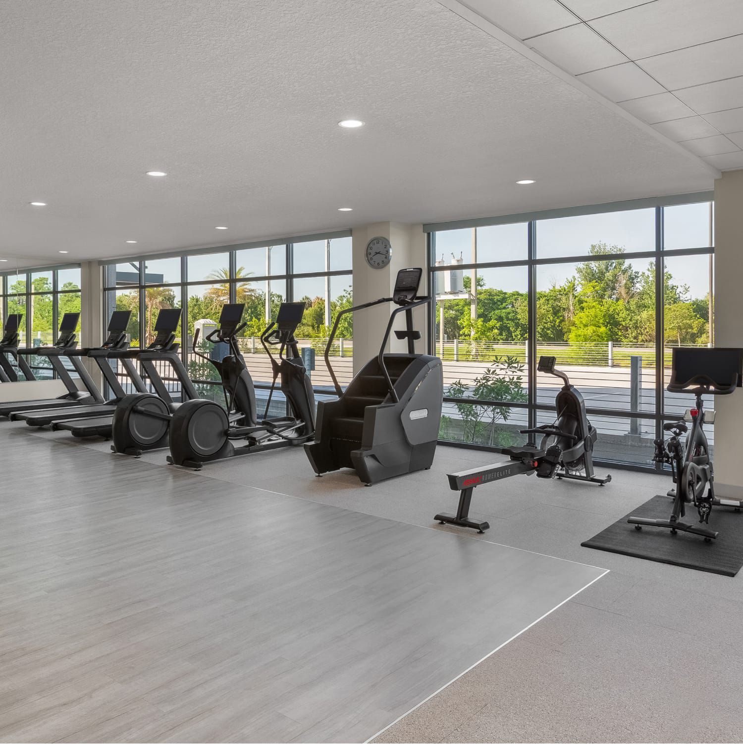 A spacious, light-filled Athletic Studio with an array of exercise equipment