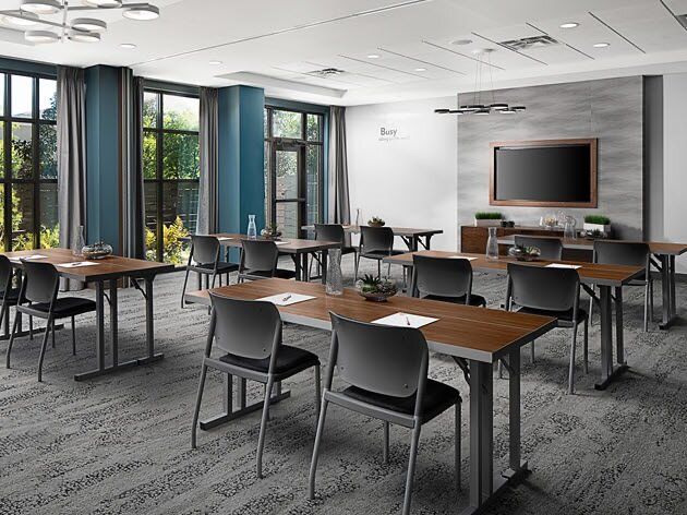  EVEN Hotels meeting room long table and chairs