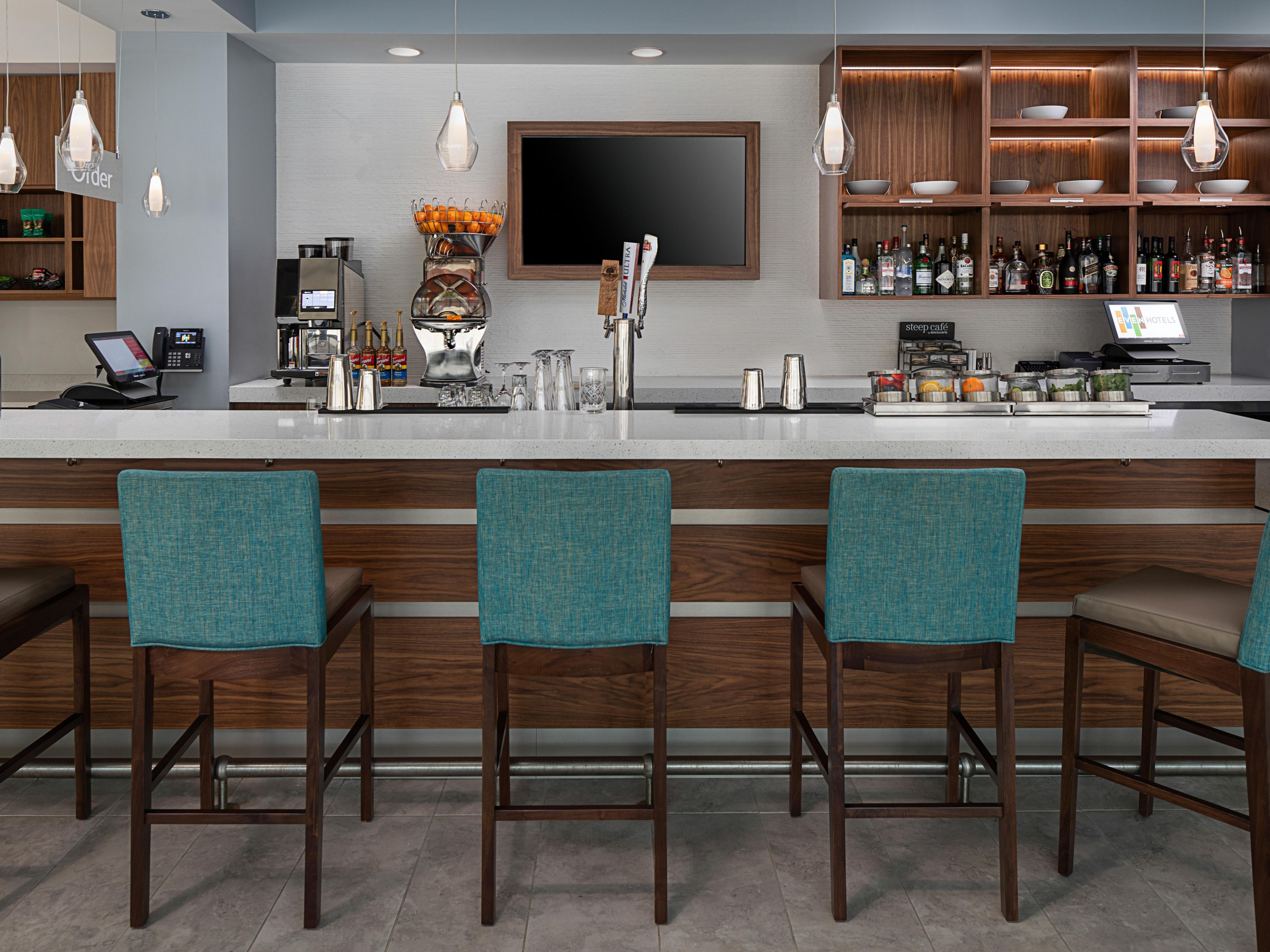 Delight your palate at EVEN Kitchen & Bar with our fall specials! Book our breakfast package for made-to-order options included with your stay. In the evening, enjoy small bites alongside our "Lavender Gimlet." Warm up with seasonal non-alcoholic coffee drinks, like the rich Tiramisu Latte and sweet Dulce De Leche Latte.