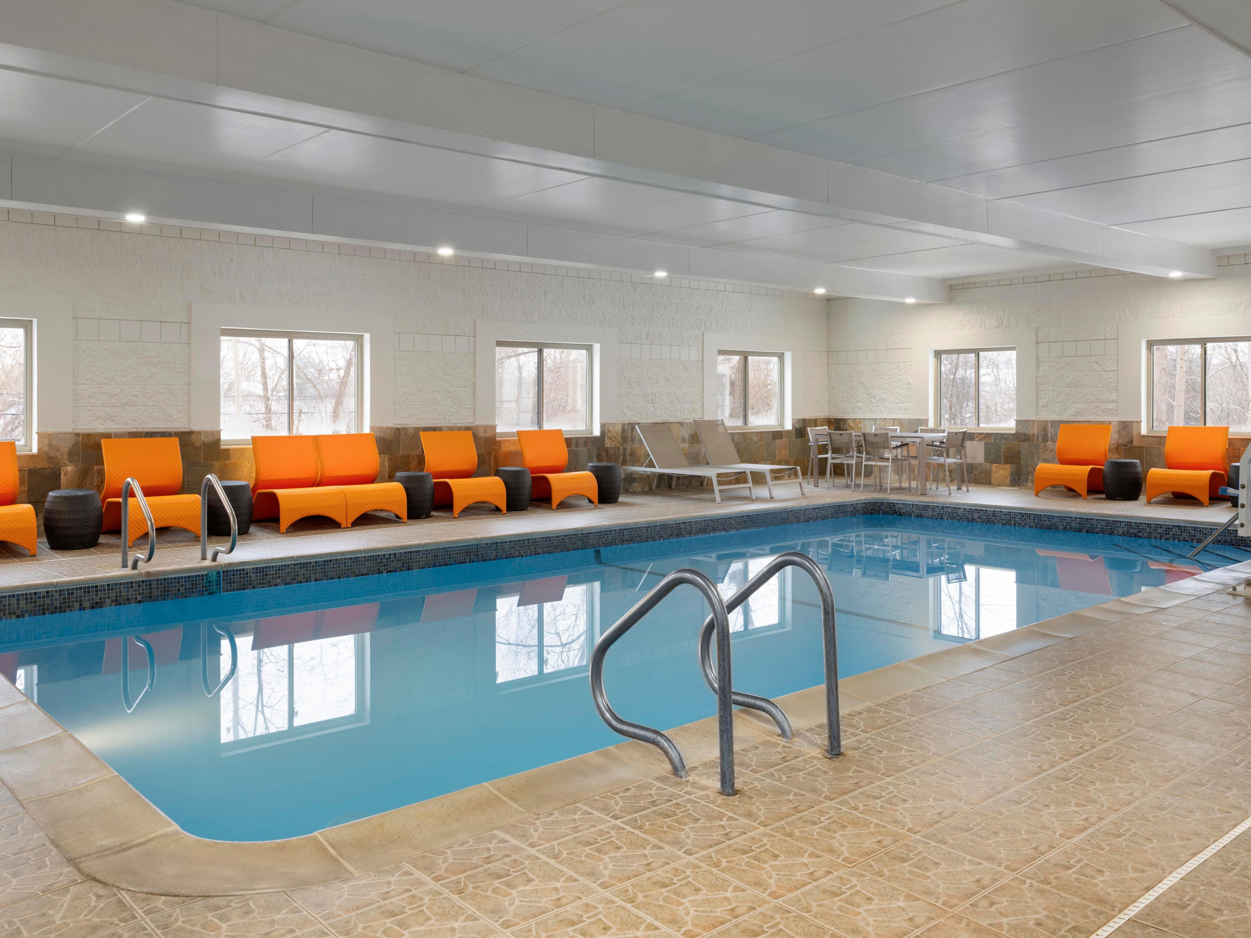Indoor pool with lounge chairs