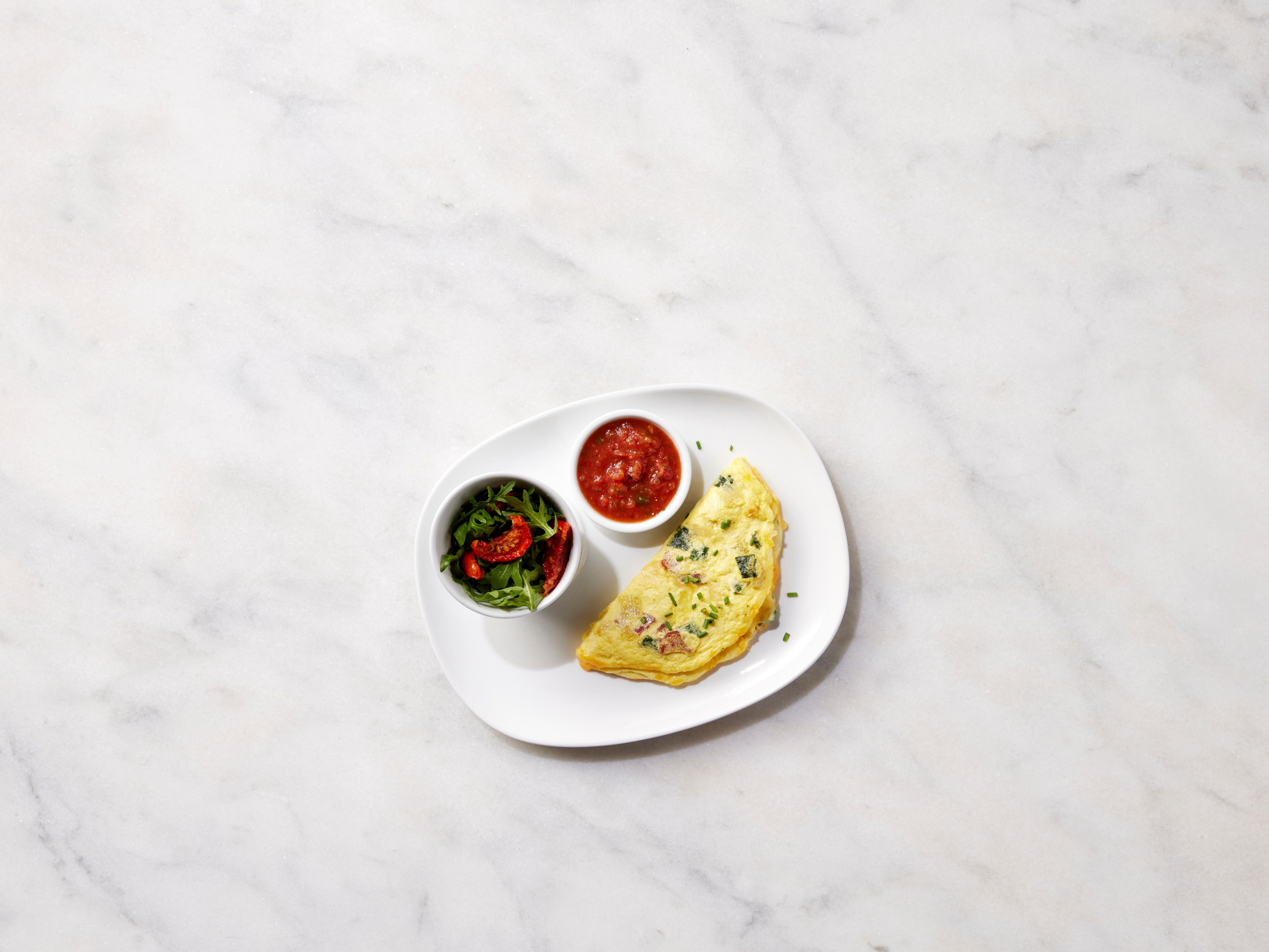 Welcome to EVEN Kitchen & Bar! Our menu is filled with fresh and flavorful options that cater to all tastes. Start your day with a hearty breakfast or enjoy a satisfying dinner. Our bar has a selection of craft beers, fine wines, signature cocktails, and delicious bites. 