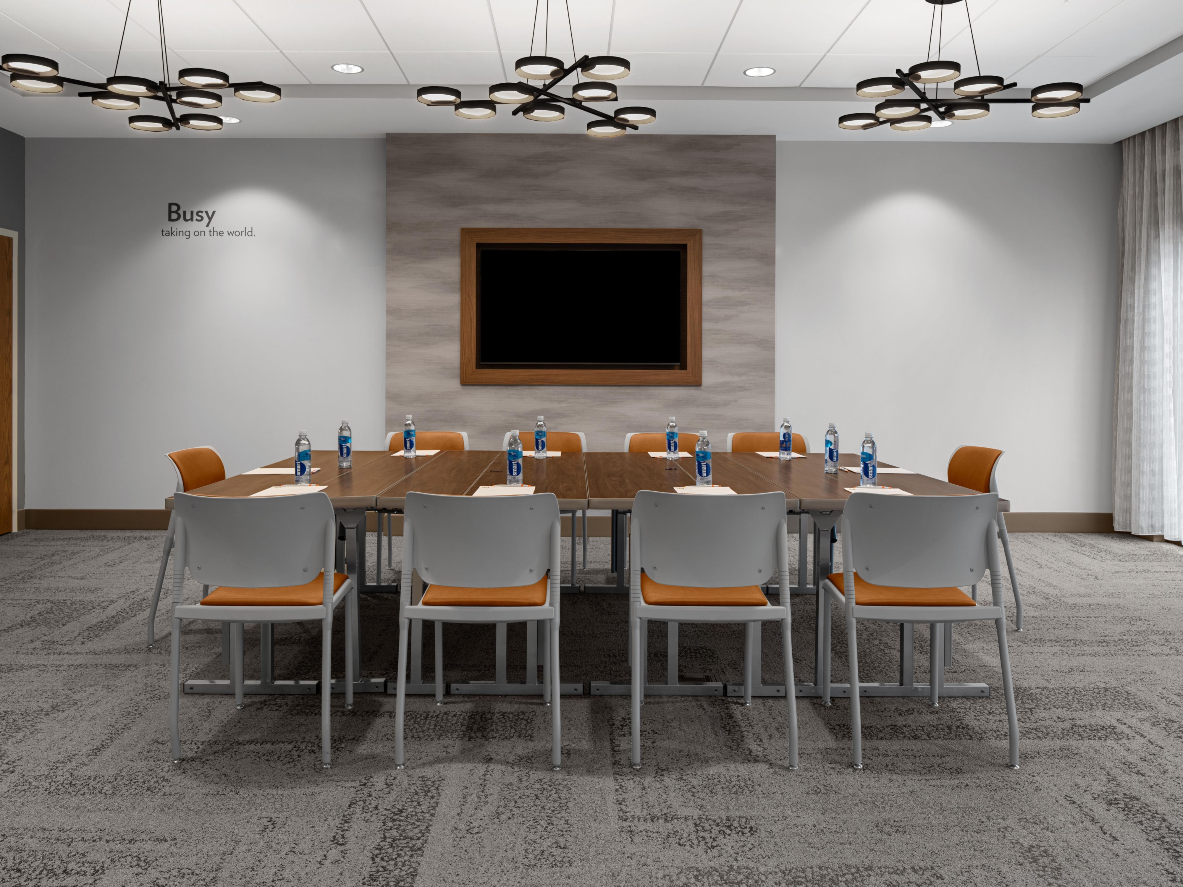 Event venue set up with individual work tables.