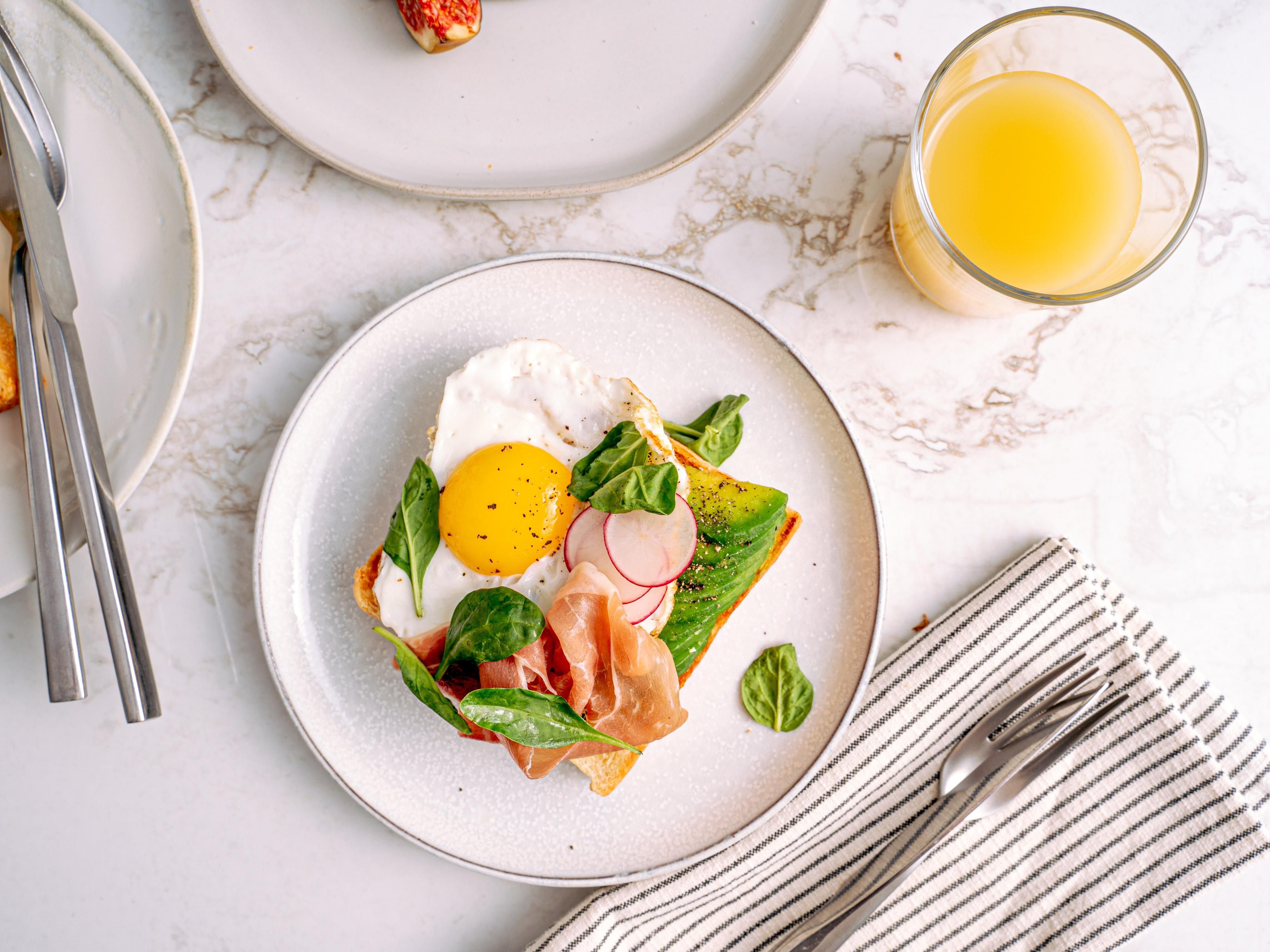 Avocado toast with prociutto and egg