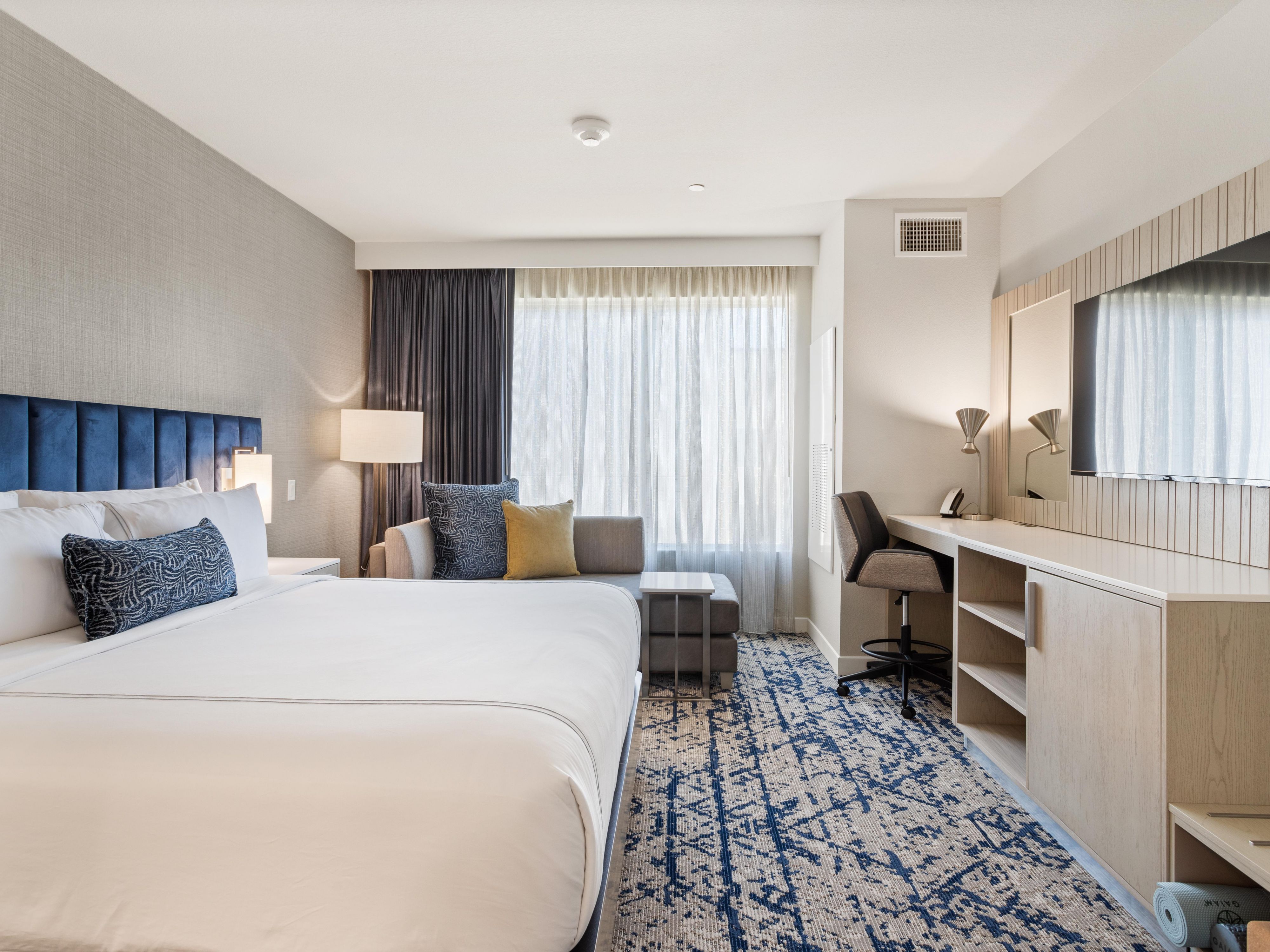 Hotel room with king bed and television
