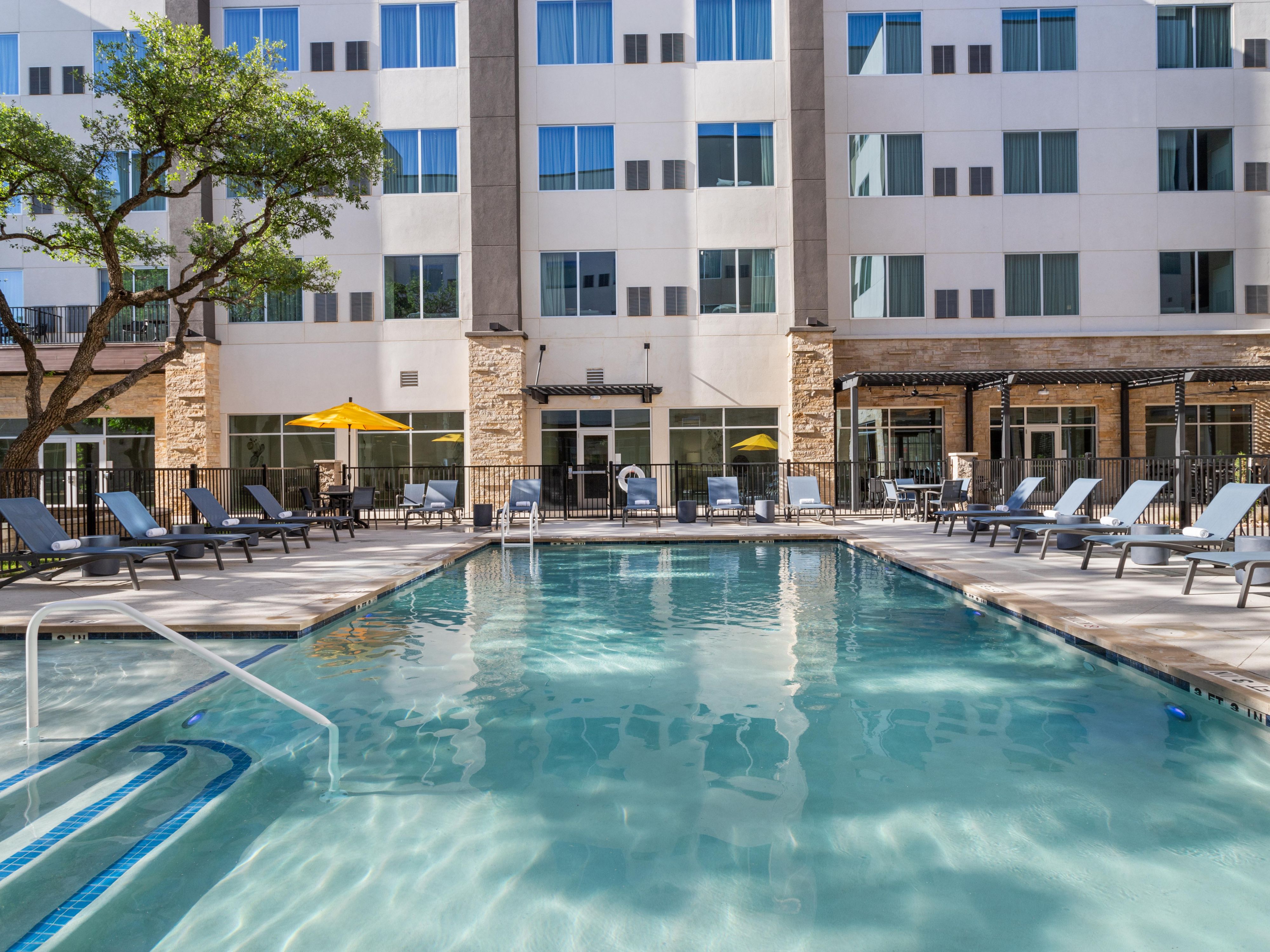 Unwind and recharge with a refreshing dip in our sparkling outdoor pool. Bask in the abundant Austin sunshine or lounge comfortably beneath a shady umbrella while sipping on a cocktail. Our poolside food and drink service ensures you are well taken care of while you relax and absorb the peaceful ambiance. Enjoy the sun while you sip and swim!