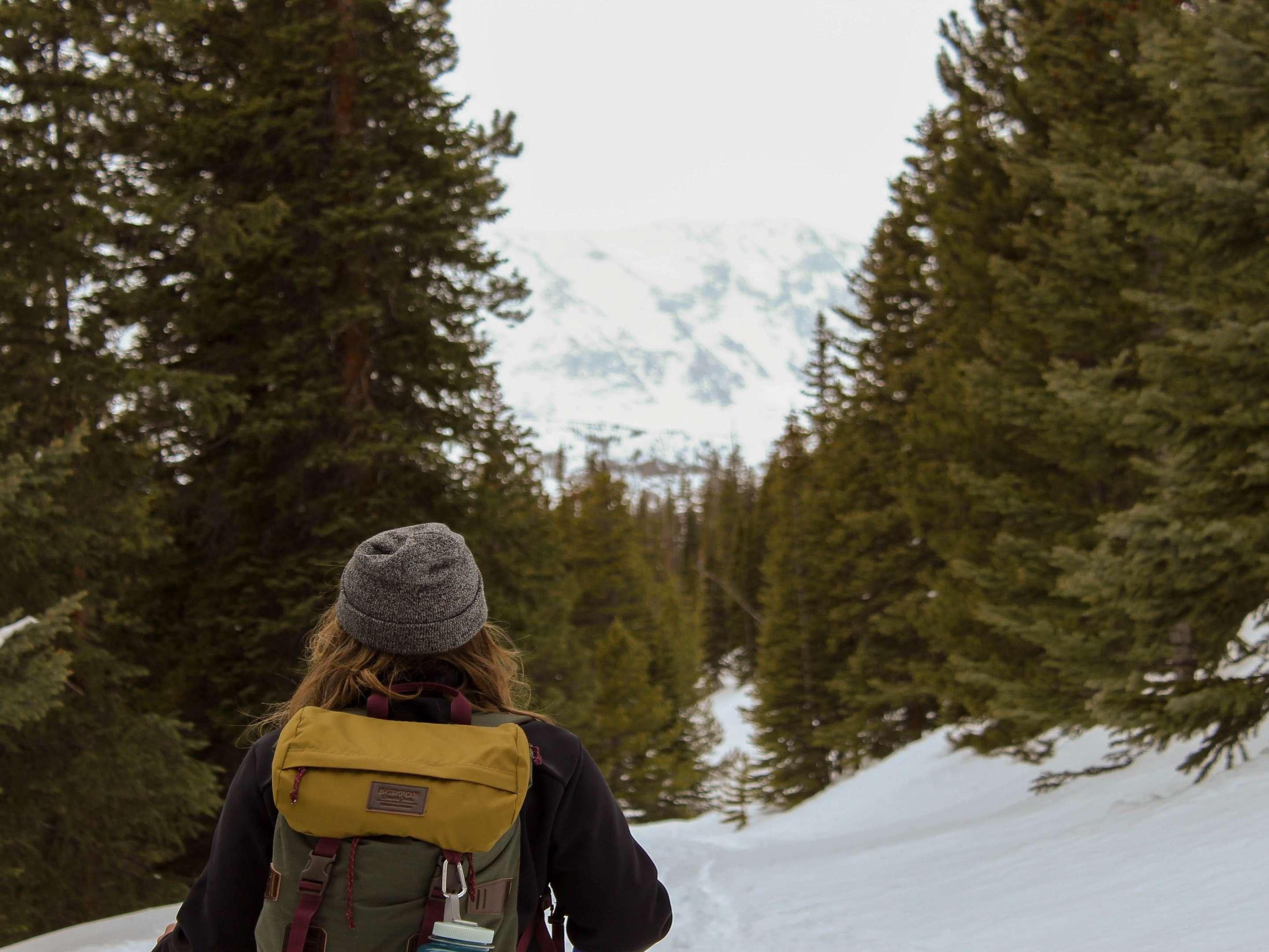 Guest hiking in the forest with plenty of snow