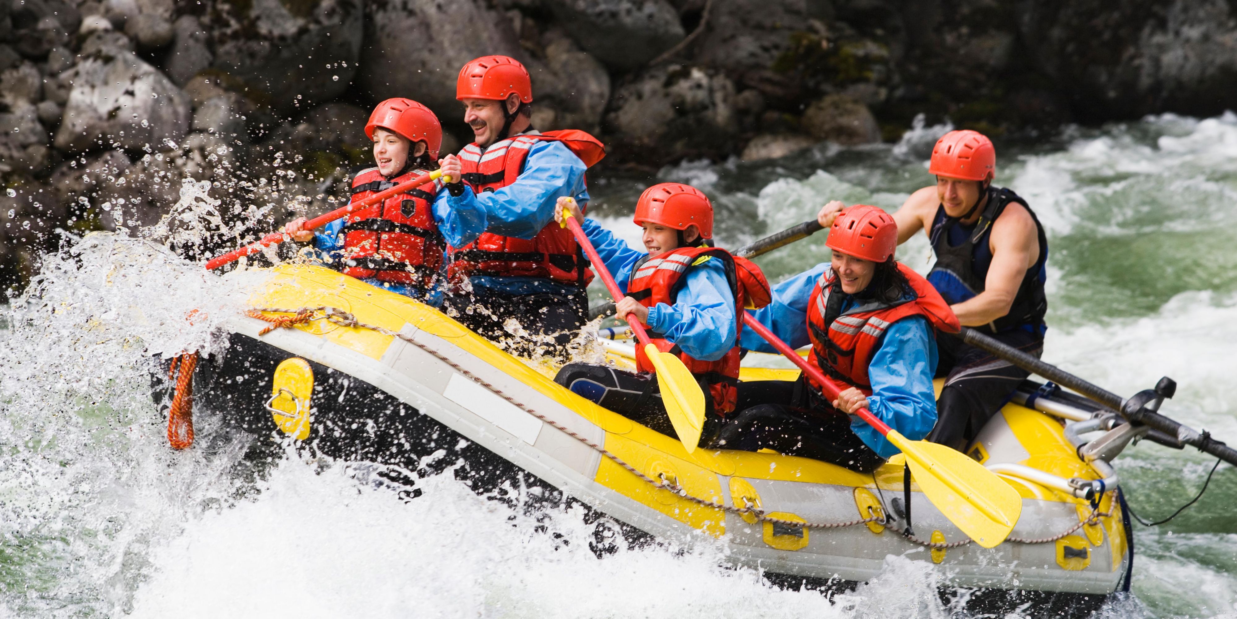 A group whitewater rafting