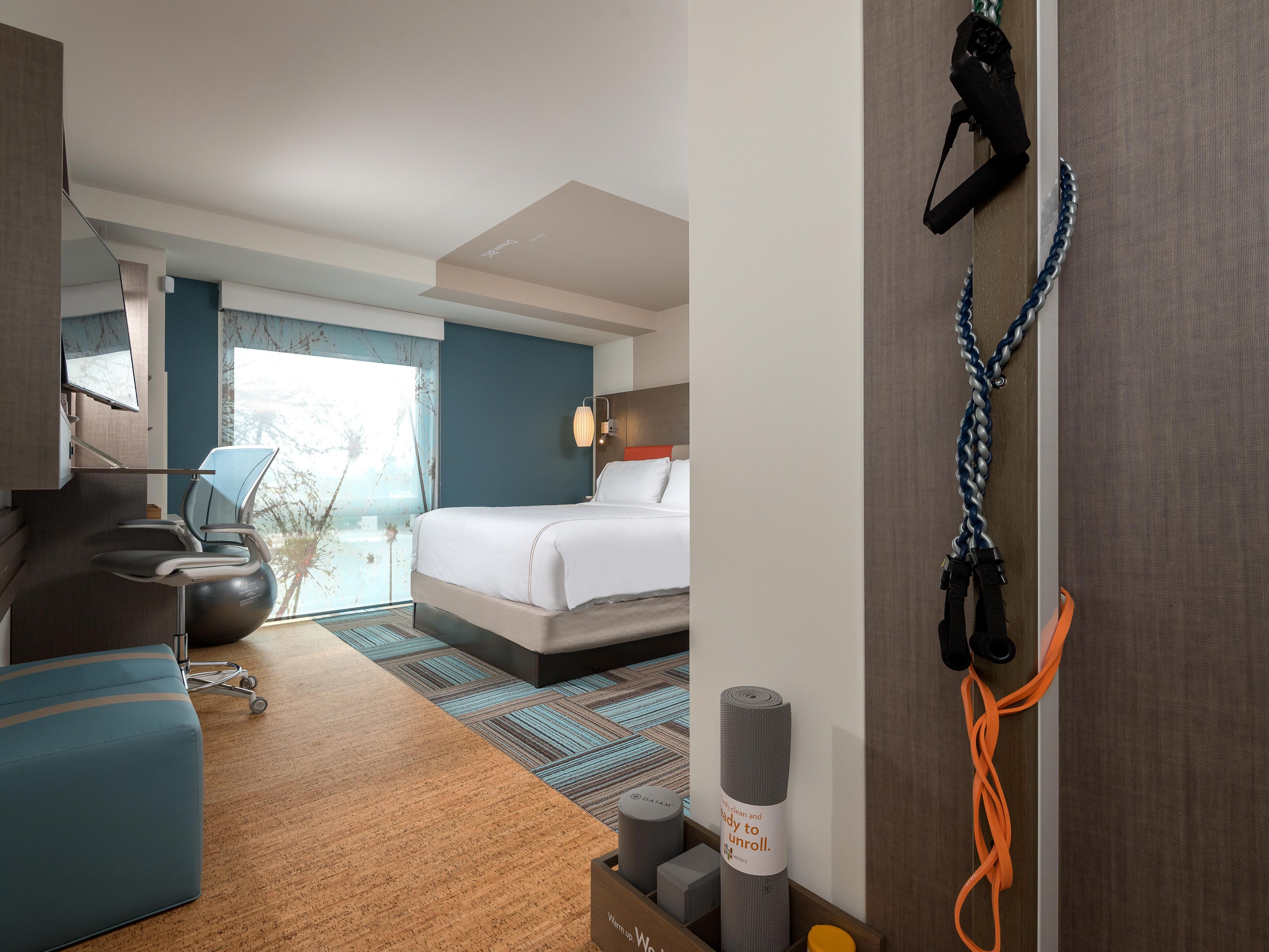Staying fit during your stay at our pet-friendly hotel is easy. Each spacious hotel room has fitness equipment and on-demand training videos, as well as flexible sitting or standing workspaces. Relax with all-natural eucalyptus linens, mood-changing LED lights, a spa-inspired shower, and EO amenities so you can wake up feeling energized. 

