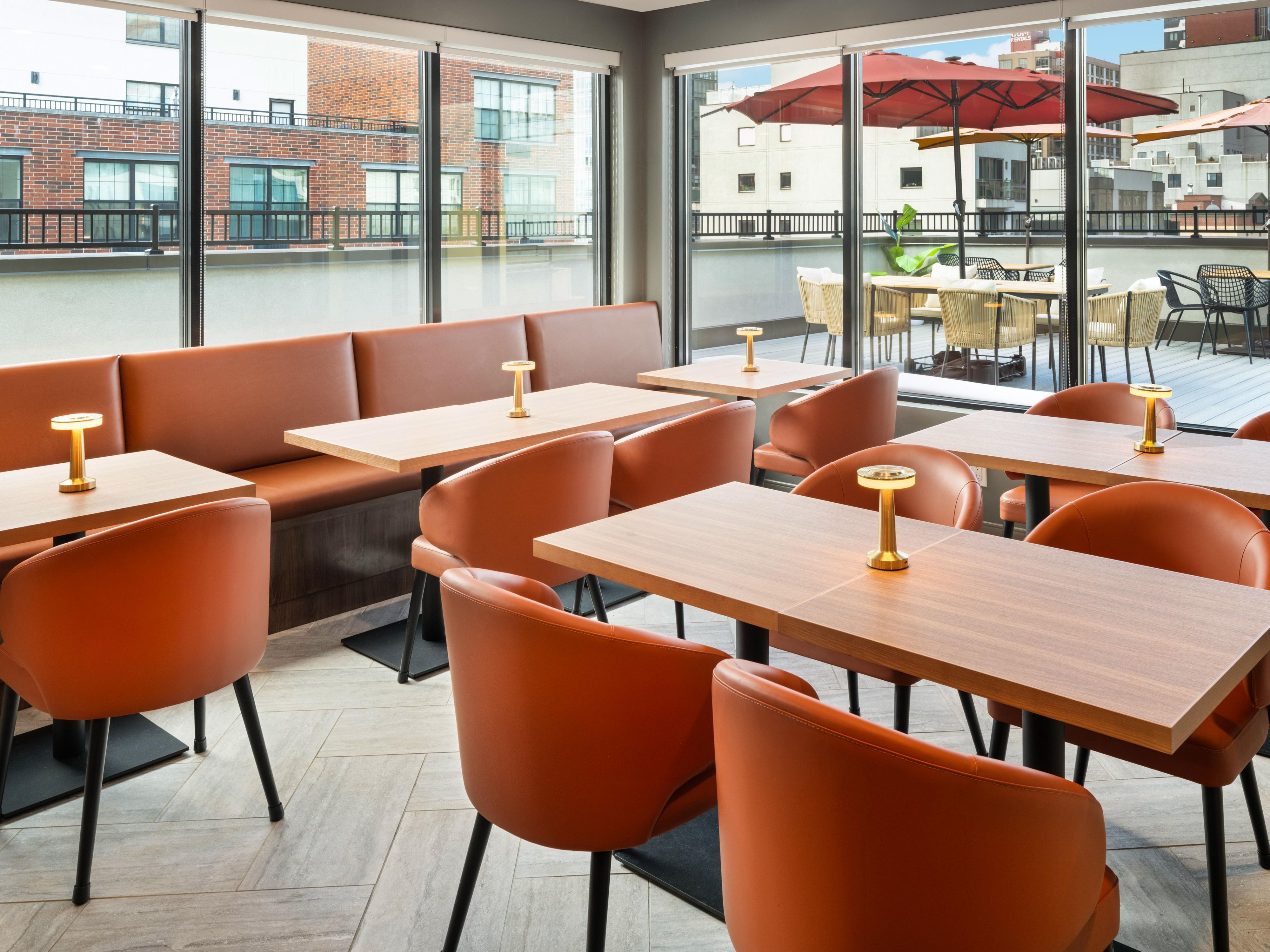 Host your next business or social gathering in our modern rooftop lounge, with 2,000 sq ft of luxurious event space. Designed to accommodate up to 50 guests, this seasonal venue offers panoramic views, sleek design, and a professional atmosphere, perfect for meetings, mixers, or creative sessions in a contemporary setting.