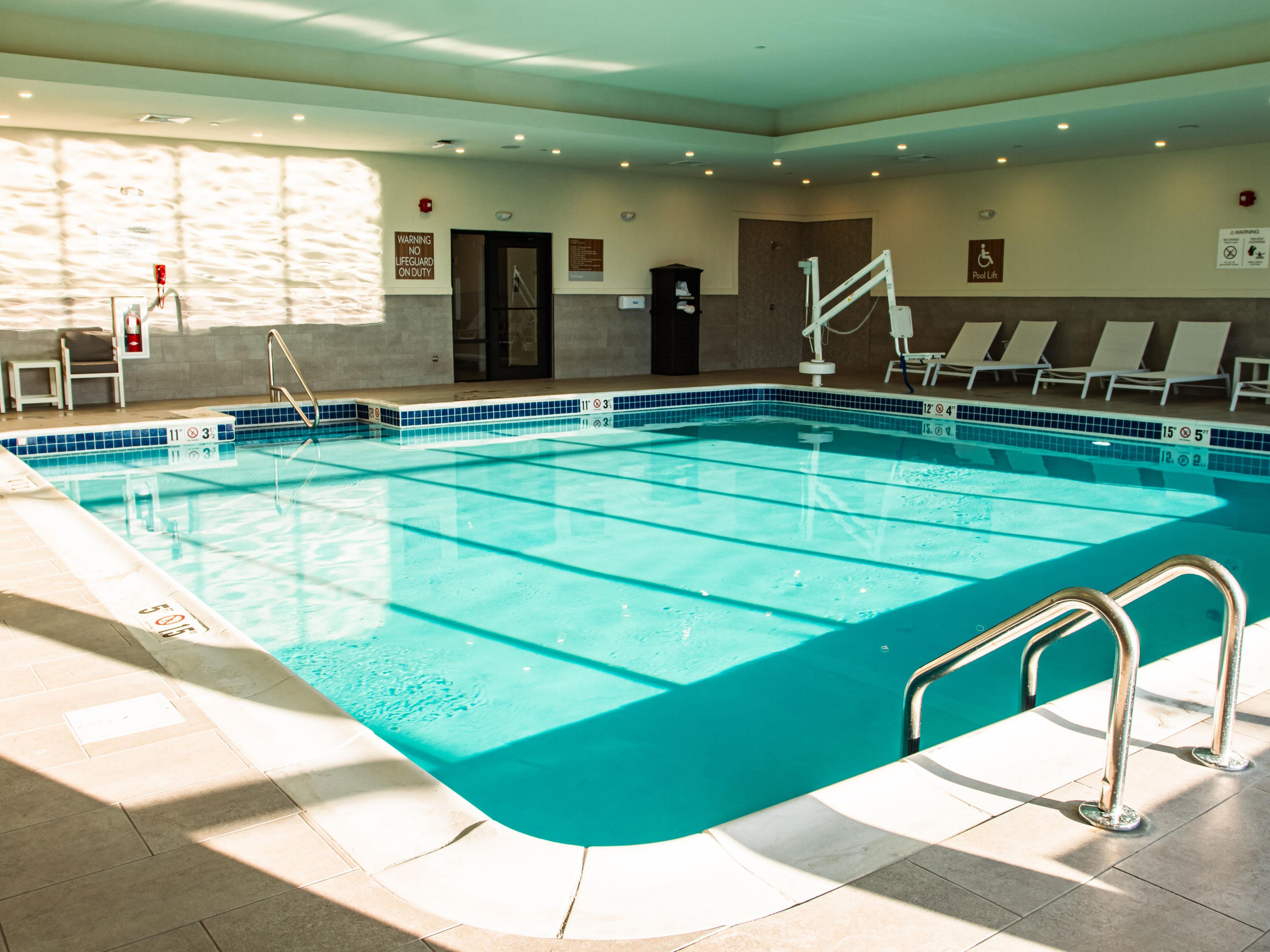 Indoor pool with lounge chairs