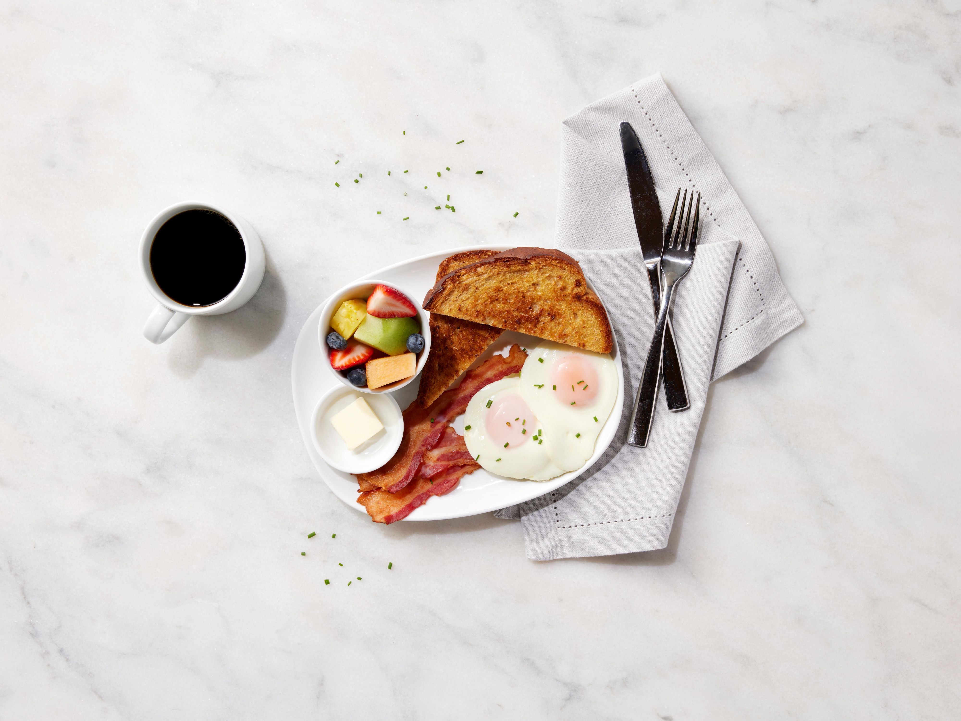 Welcome to EVEN Kitchen & Bar! Our menu is filled with fresh and flavorful options that cater to all tastes. Start your day with a hearty breakfast or enjoy a satisfying dinner. Our bar has a selection of craft beers, fine wines, signature cocktails, and delicious bites. 