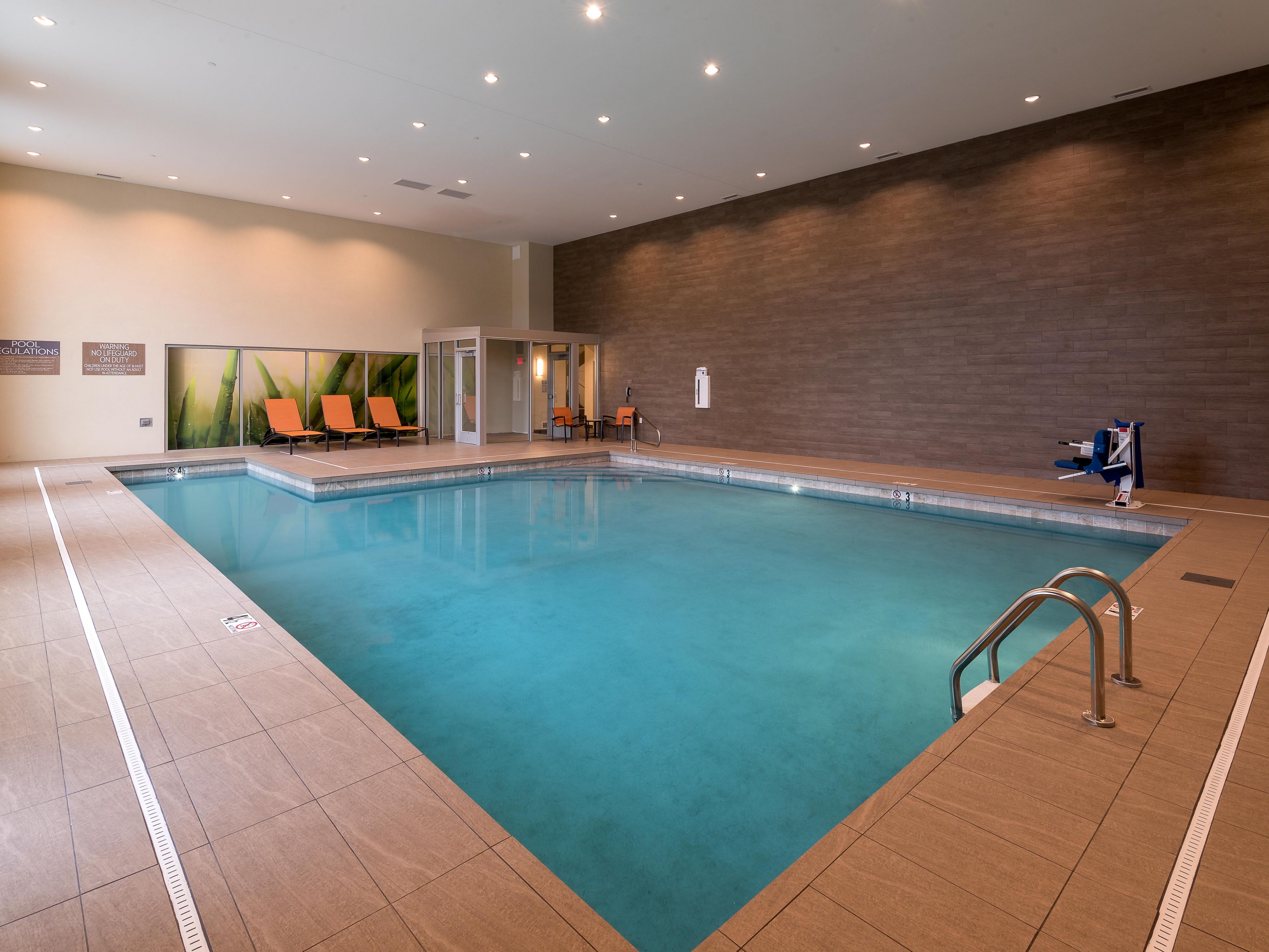 Indoor pool with lounge chairs