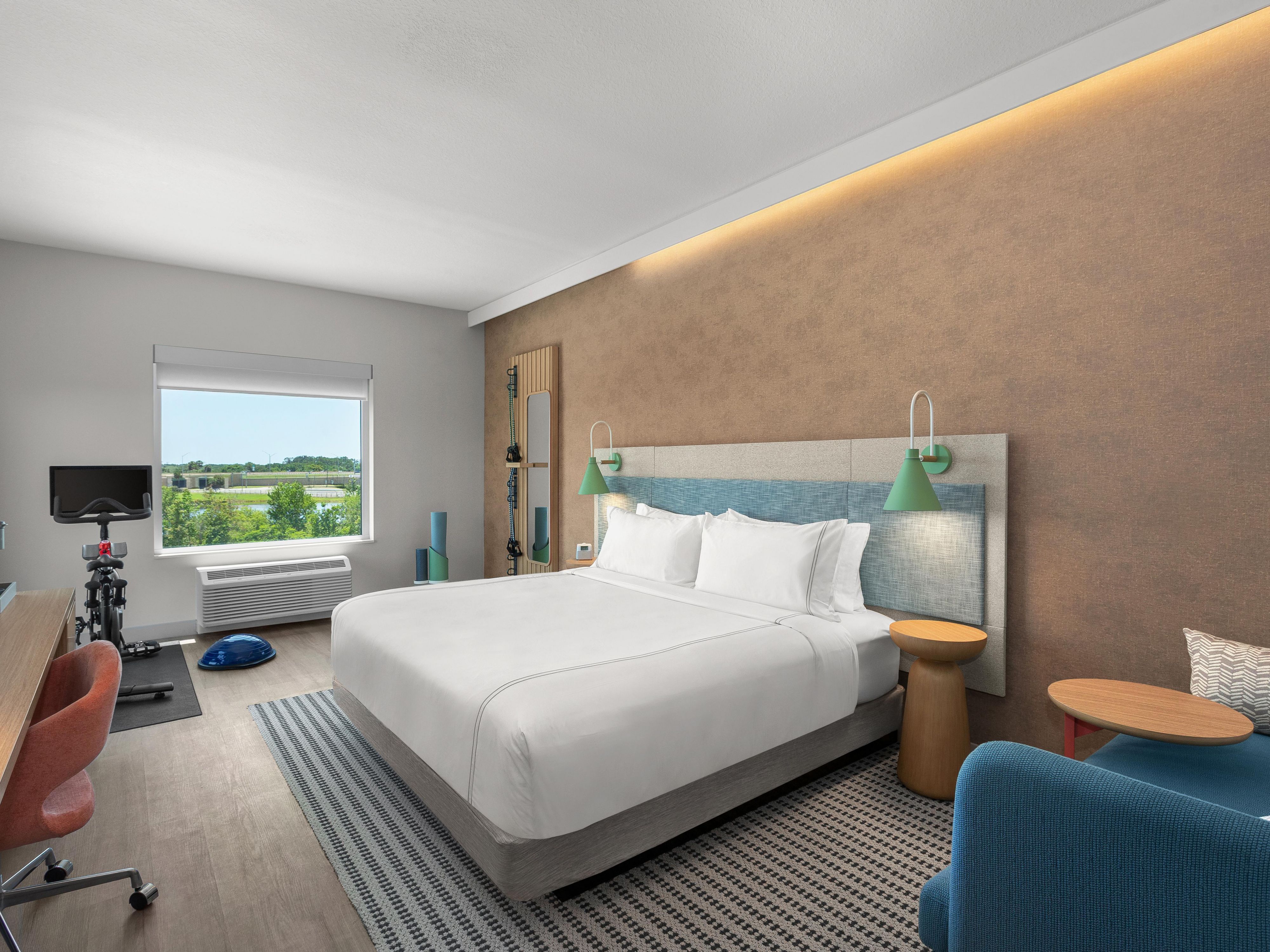 Experience the perfect blend of comfort and functionality in our spacious rooms, equipped with modern amenities such as ergonomic workspaces, premium bedding, and spa-inspired showers. Stay energized and focused with in-room fitness spaces and health-conscious snacks, ensuring you feel refreshed and balanced during your stay.