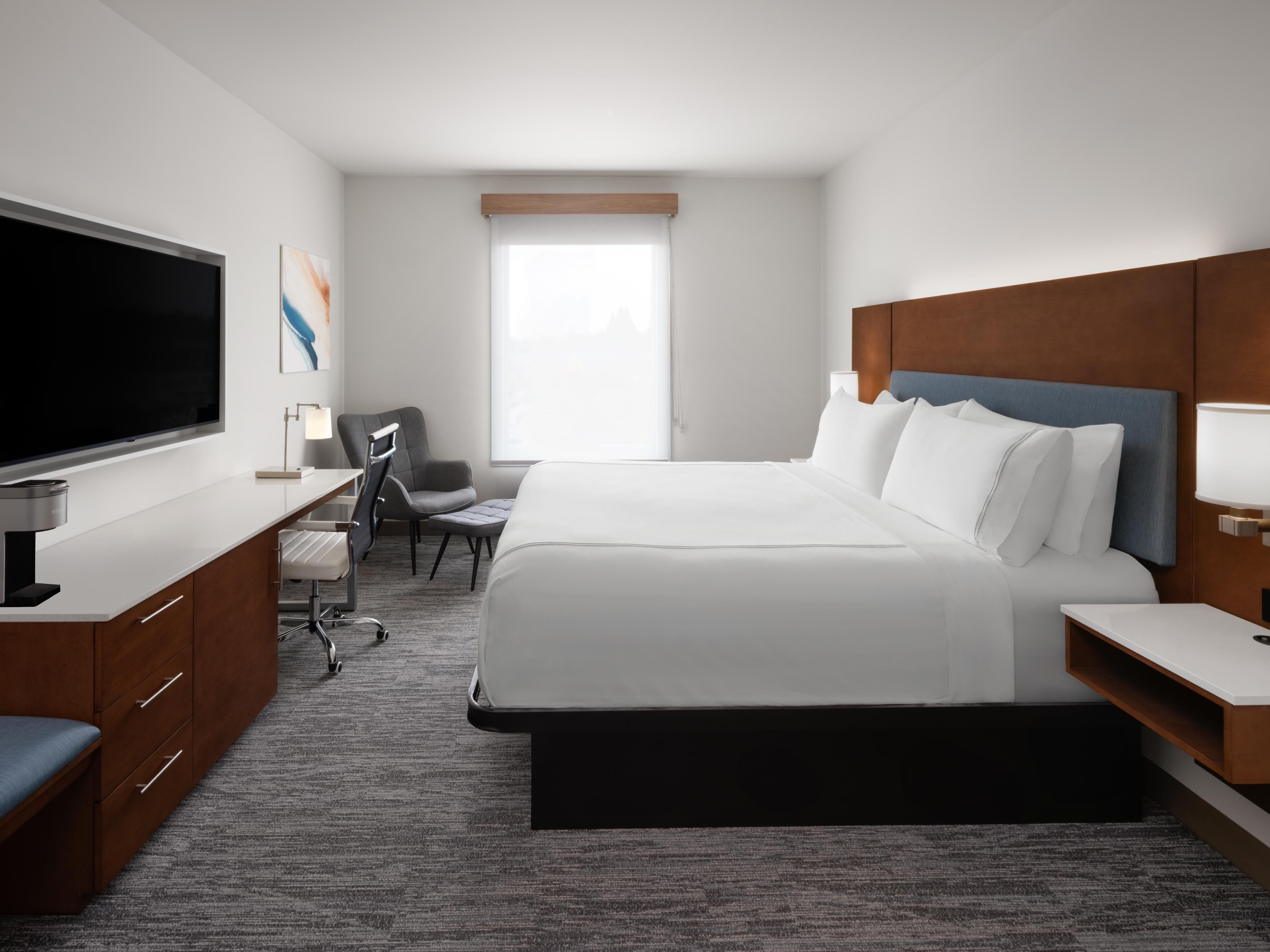 Unwind in a cozy King Bed Guest Room crafted for your comfort.