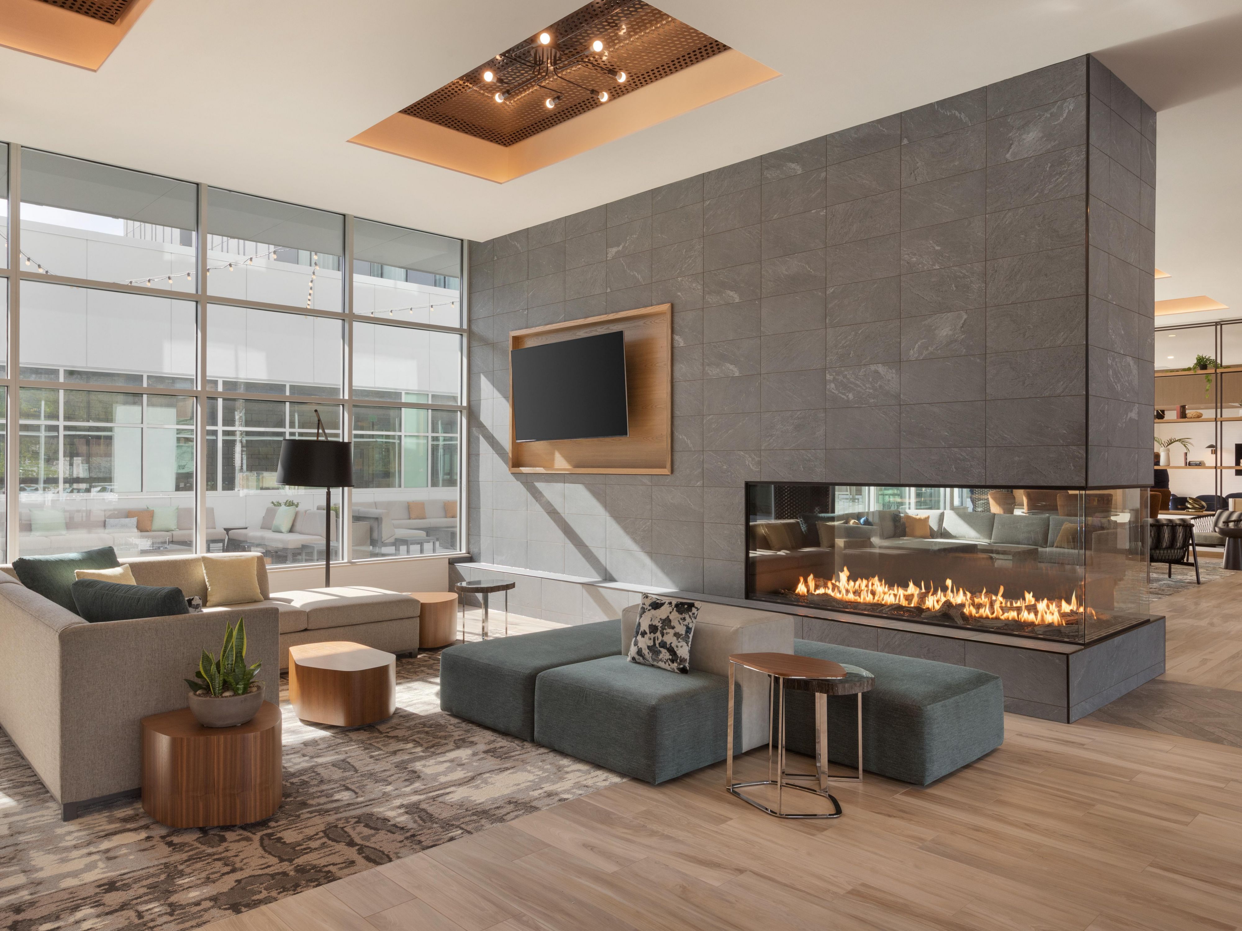 Cozy up by the fireplace in our hotel lobby.