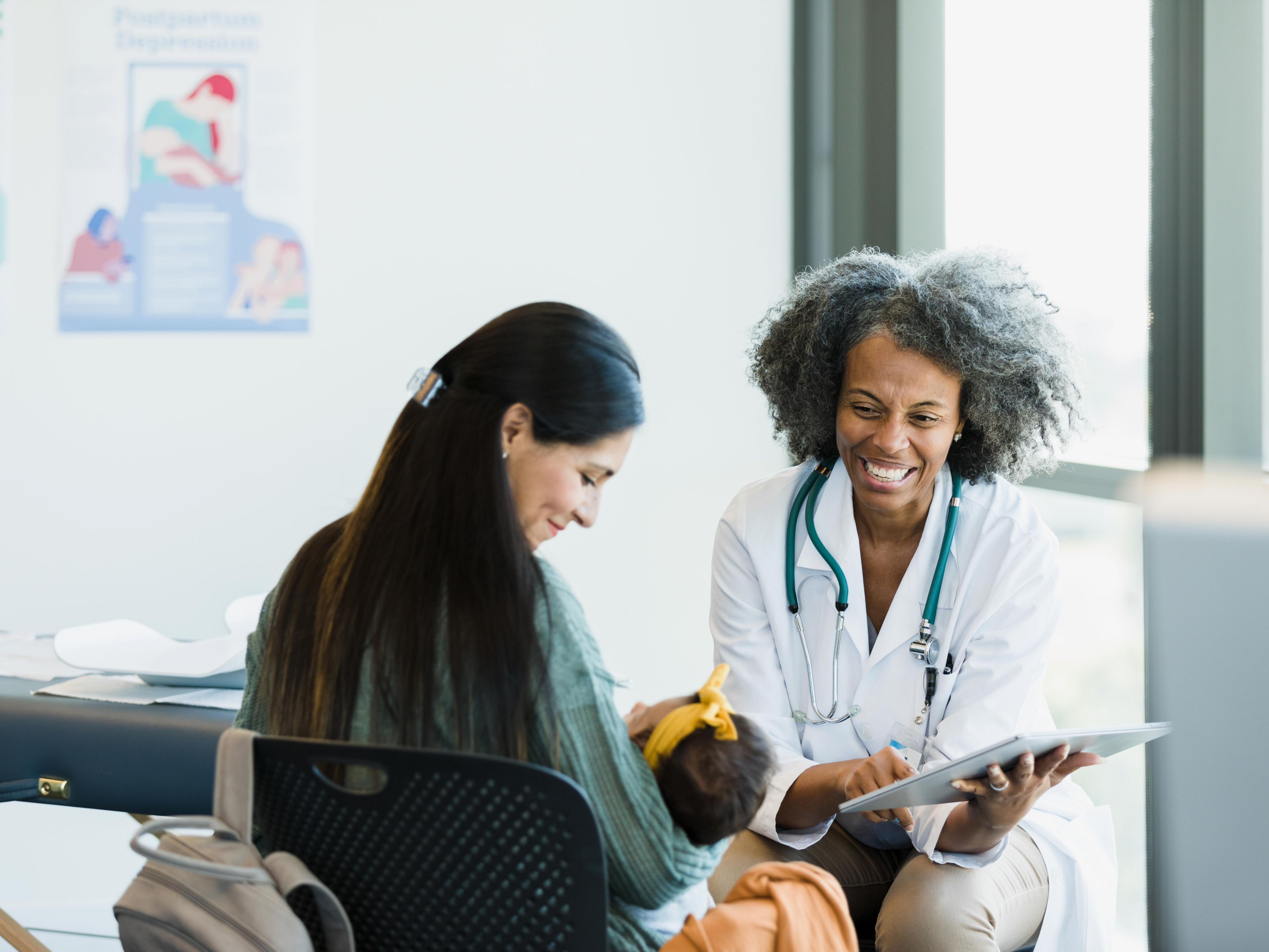 Doctor consulting with mother and child