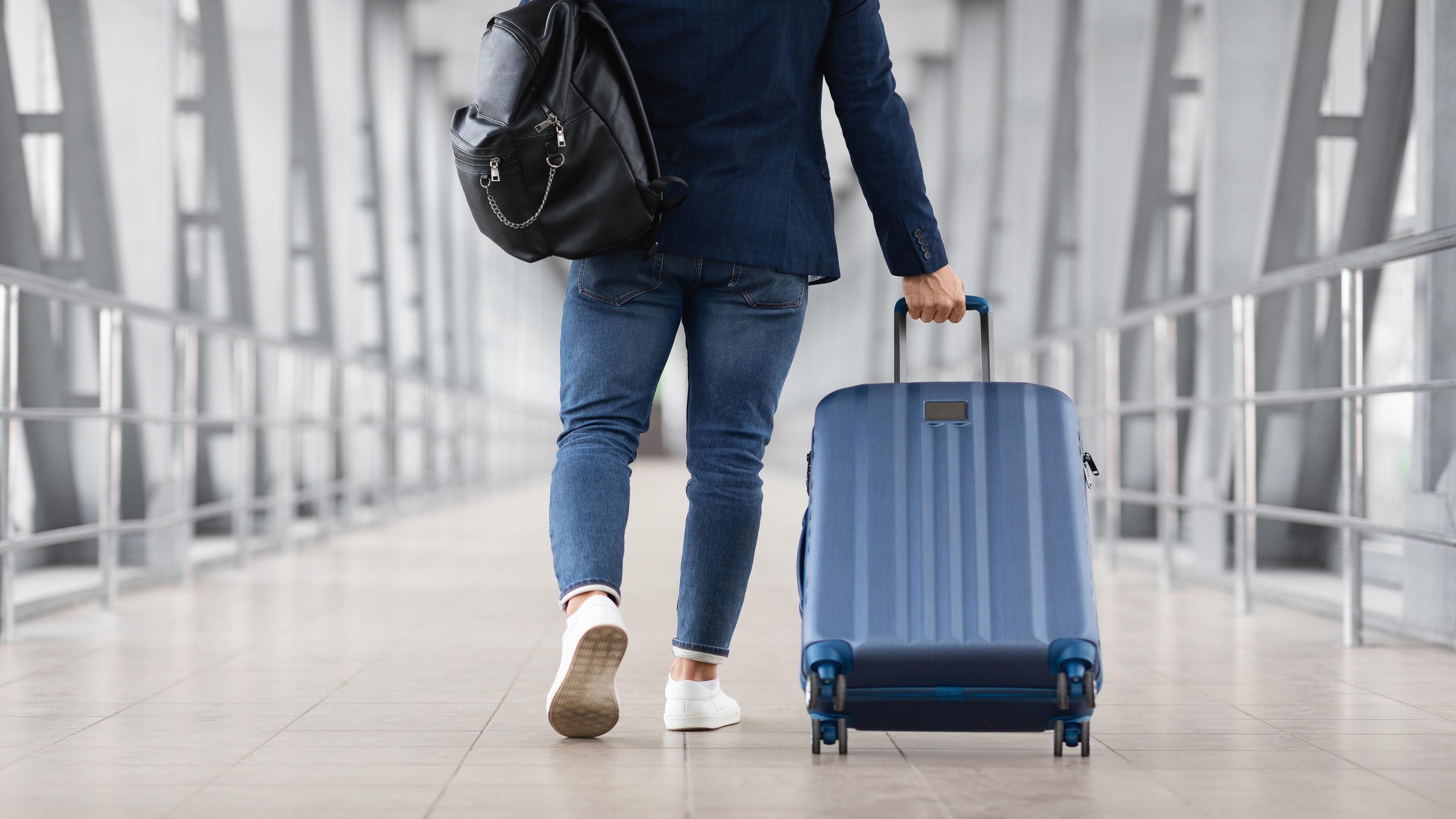 Person wheeling luggage