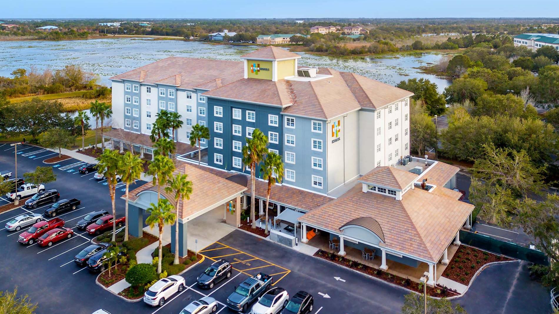 Exterior of the hotel with blue skies and plenty of trees