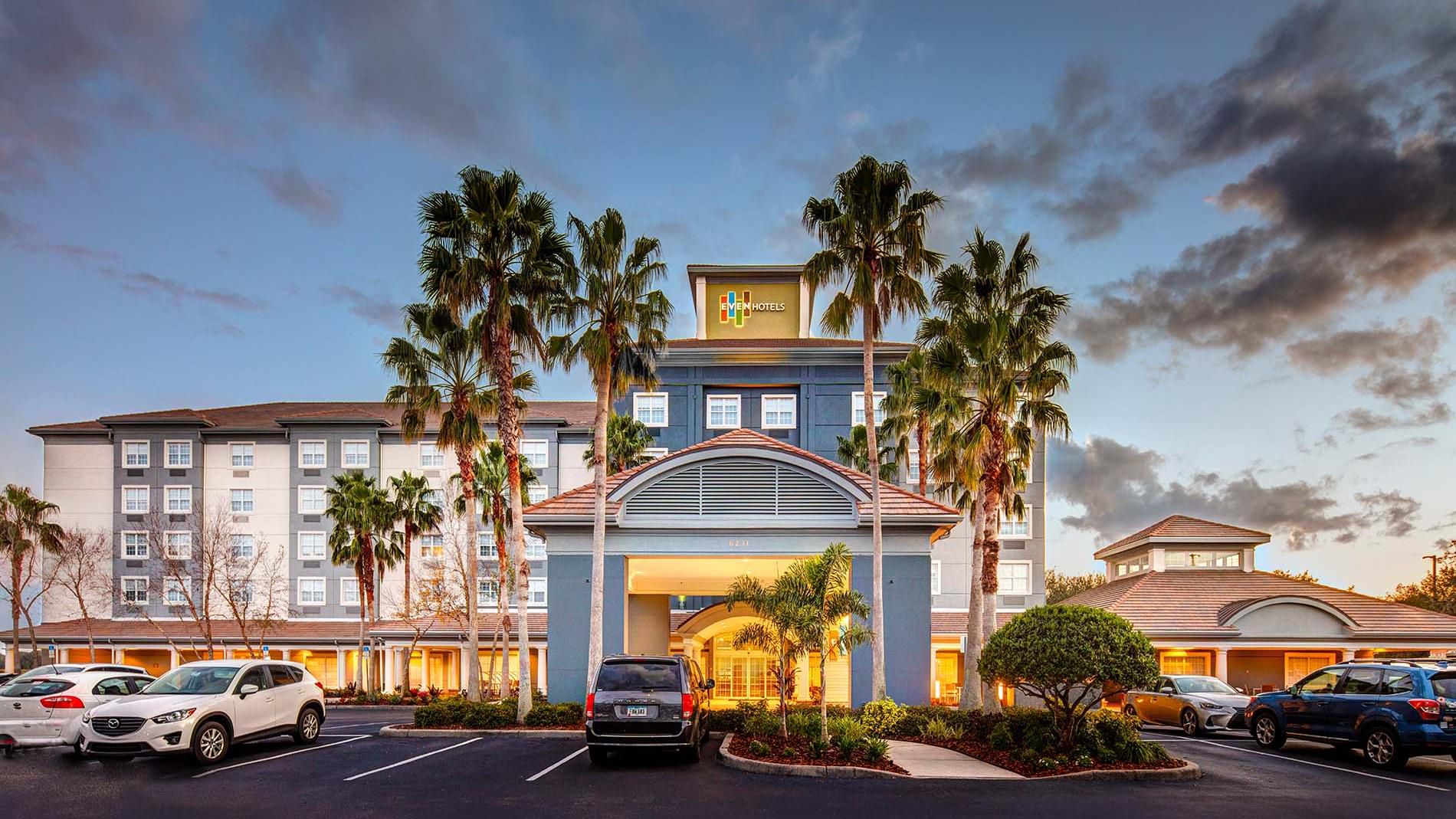 Exterior of the hotel with blue skies and plenty of trees