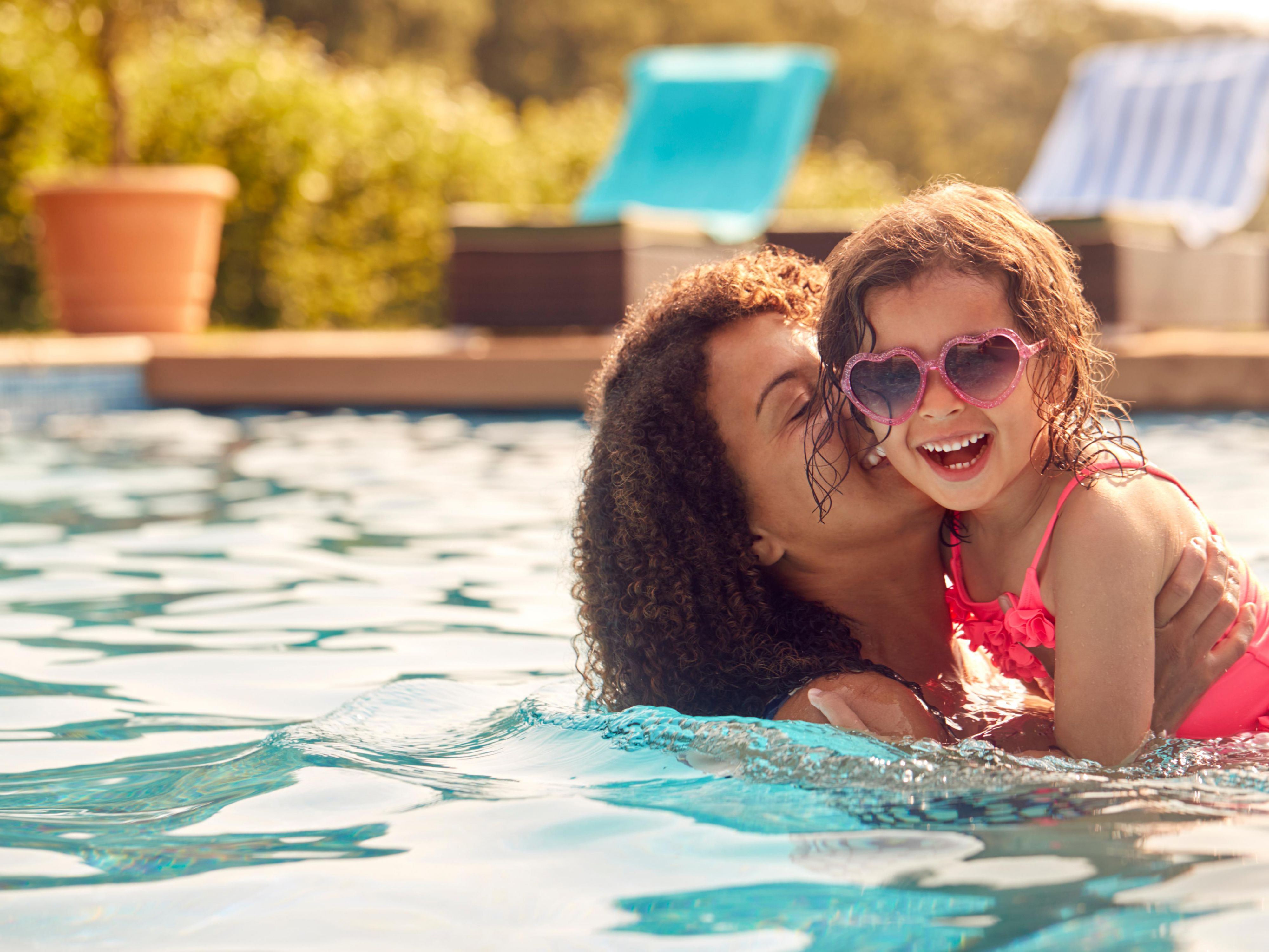 Mother and daughter swimming
