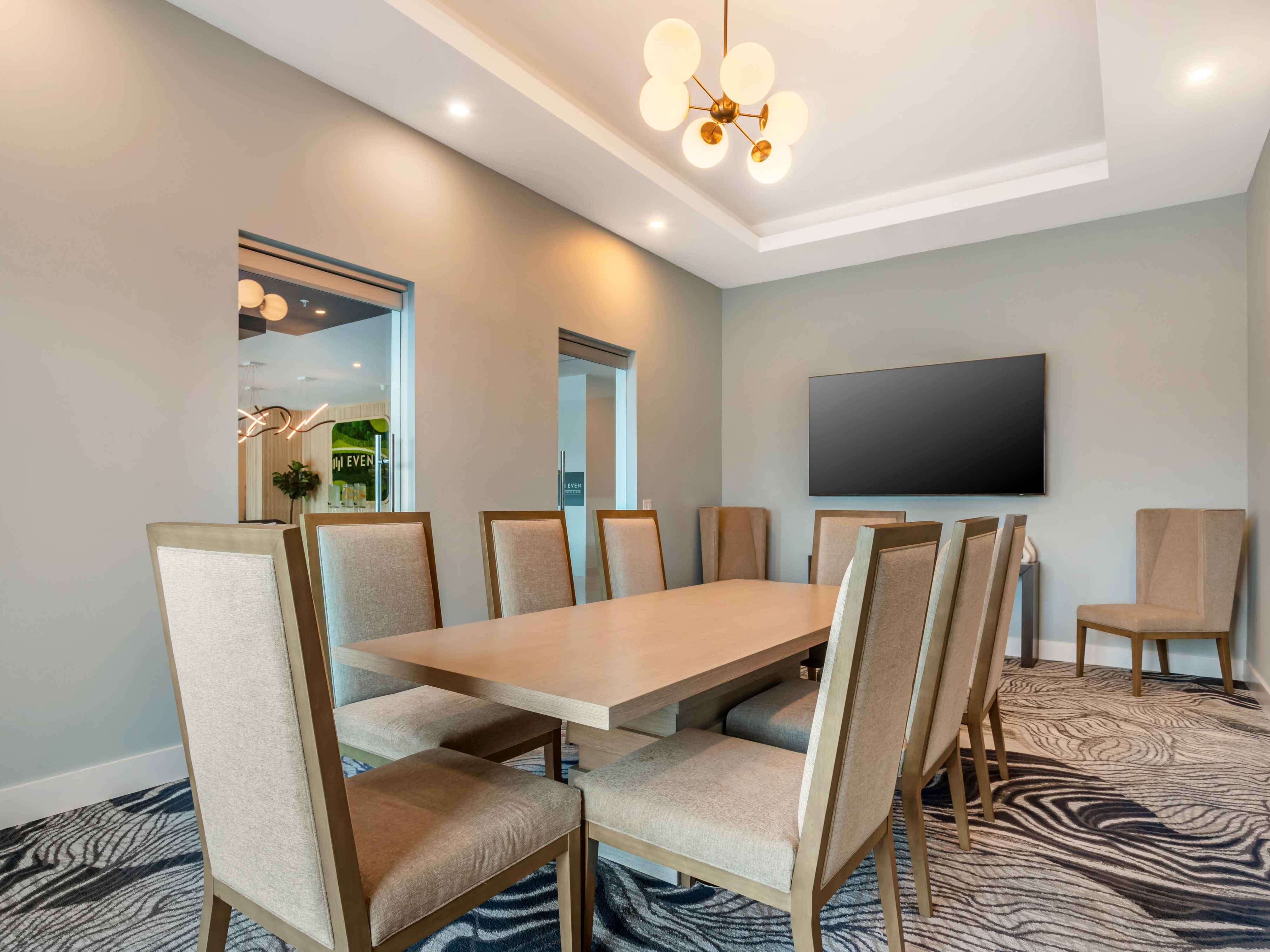 Conference room with meeting table and a TV