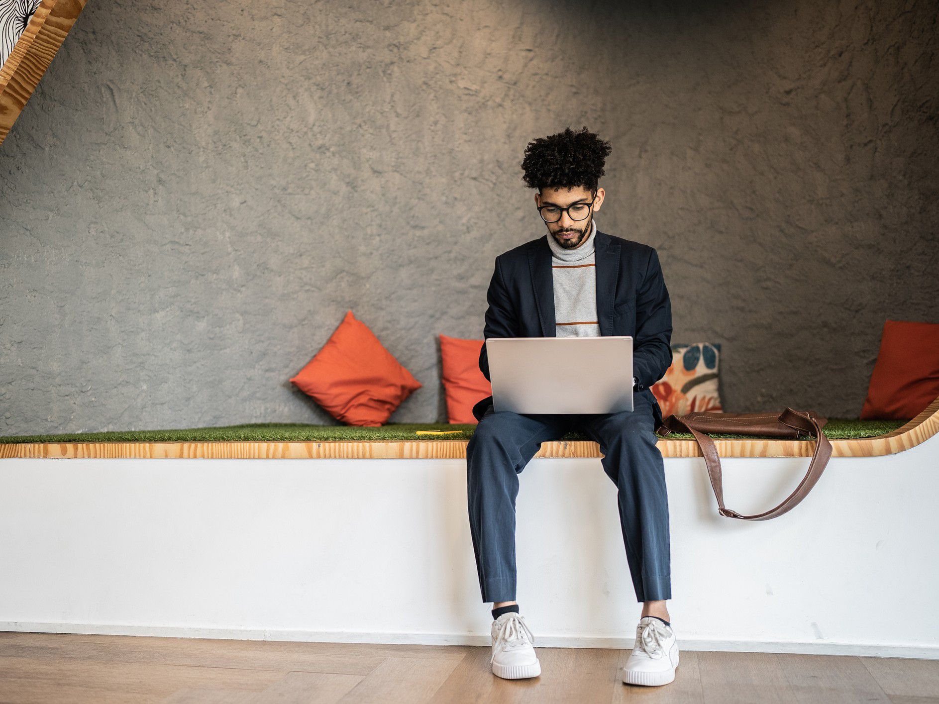 Young man working in a modern office setting