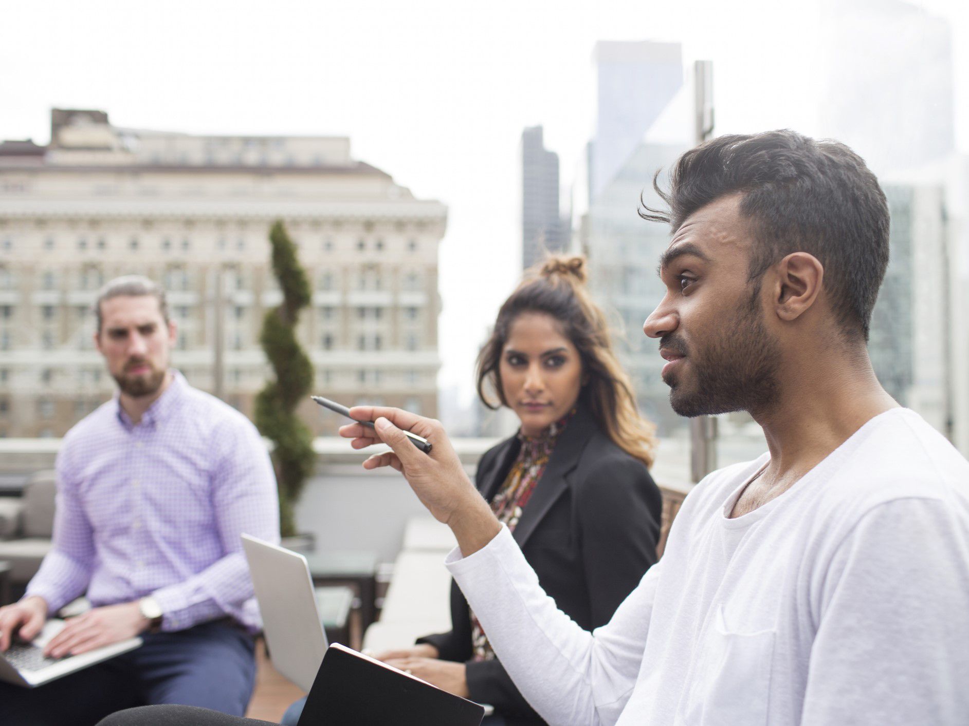 Small professional team meeting on a rooftop