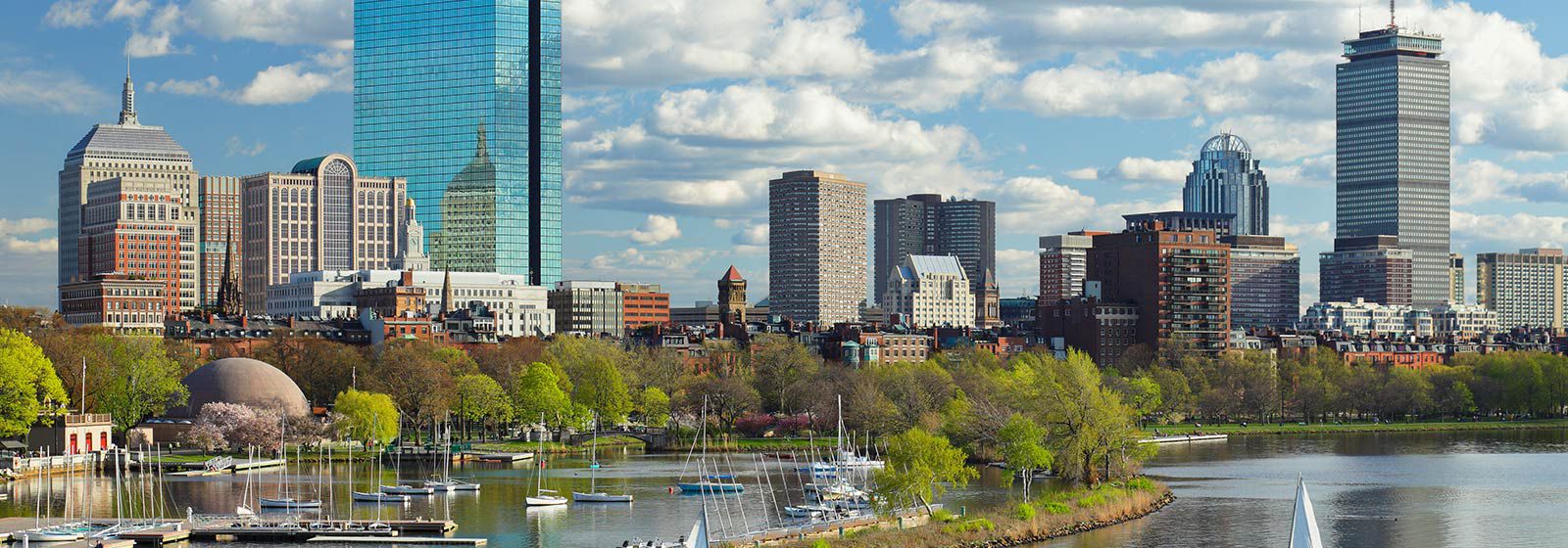 Wider view of Boston city skyline and water