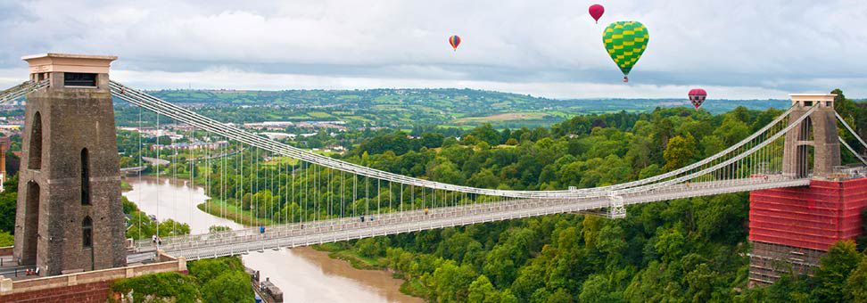 Clifton bridge with hot air balloons floating in the distance 