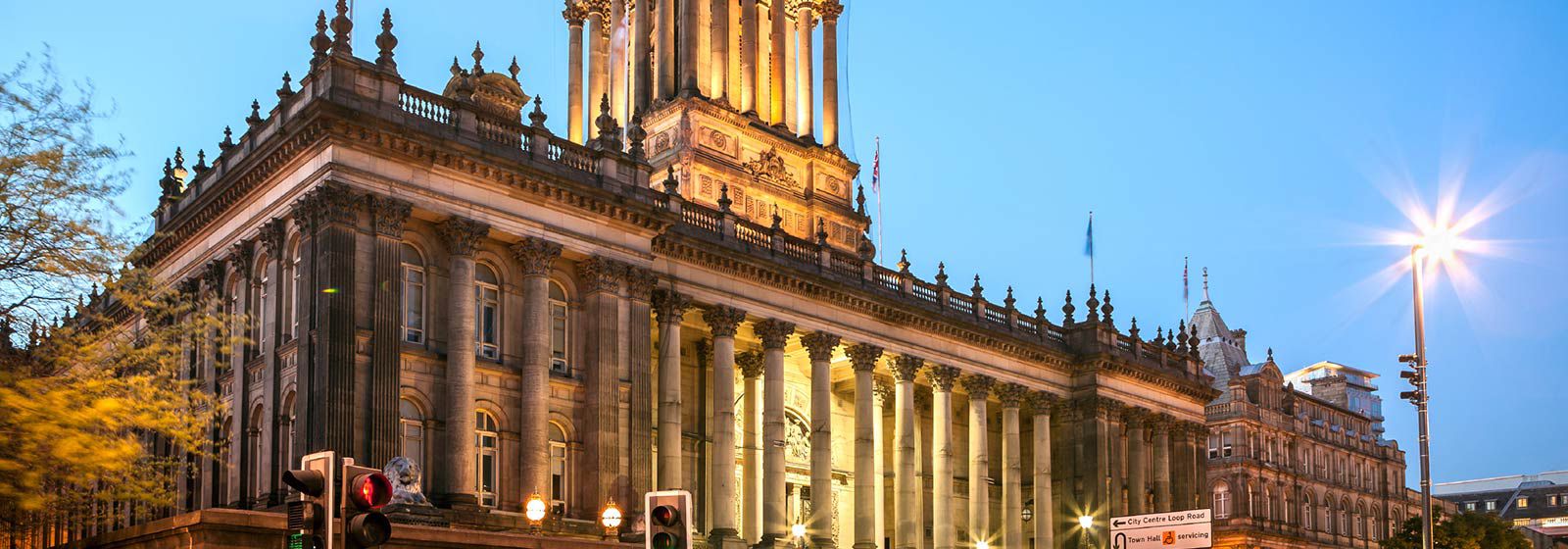 View of Leeds town hall with bright blue sky 