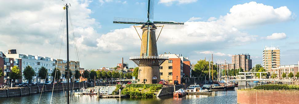 Windmill surrounded by ports and buildings