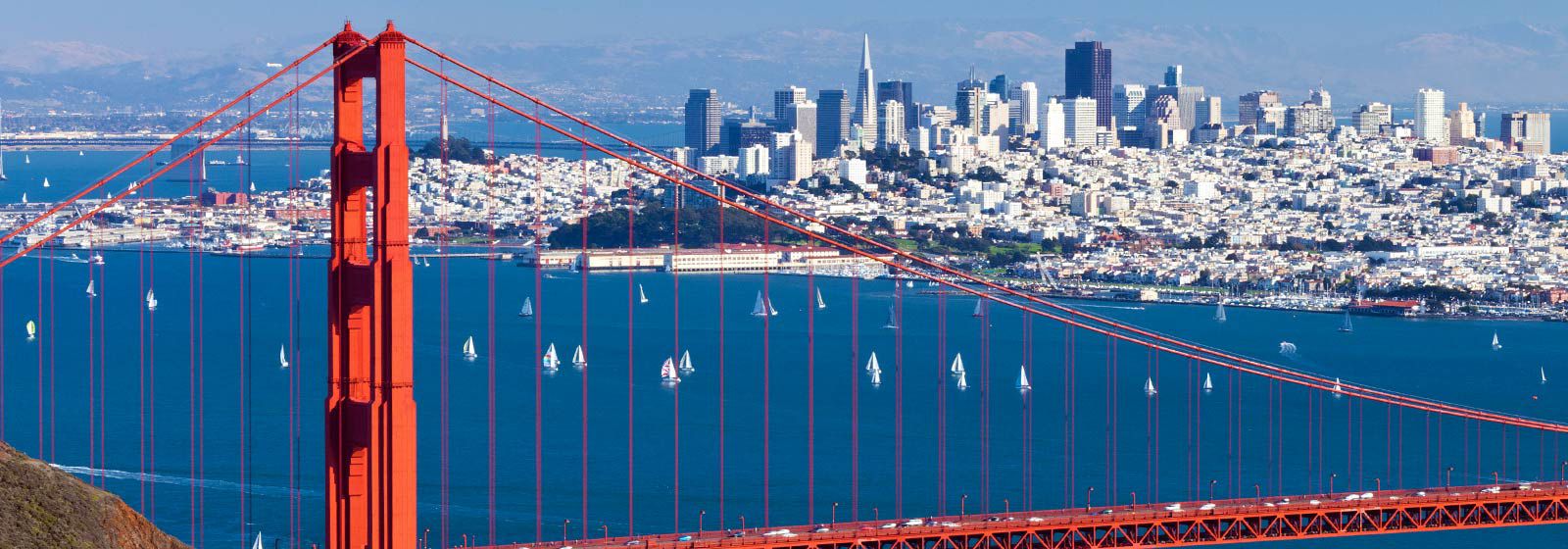 Skyline of San Francisco with Golden Gate Bridge in foreground