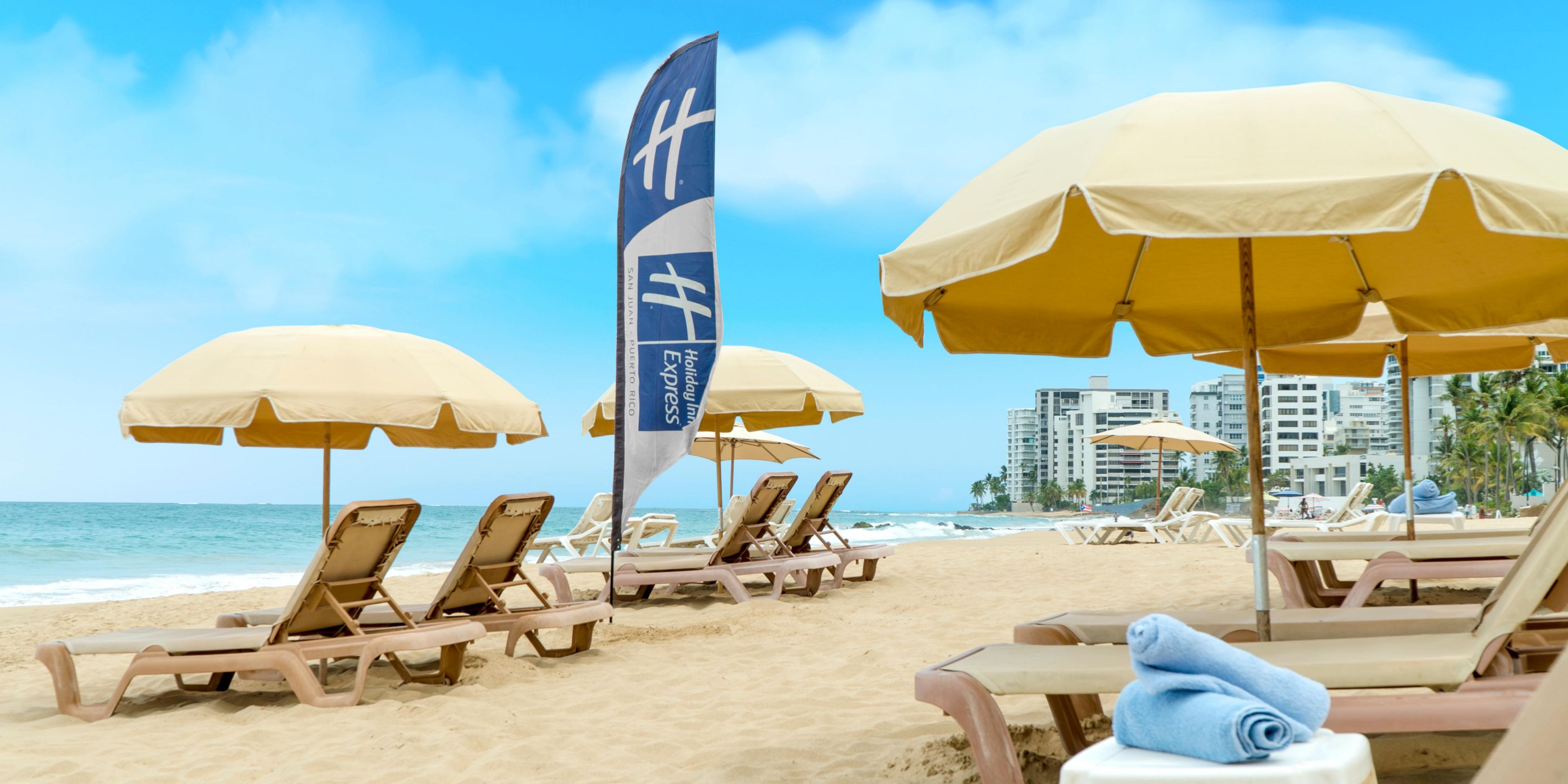 Beachfront view of chairs and umbrellas setup