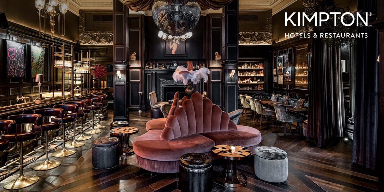 Deep toned bar area with velvet mauve seating in the center