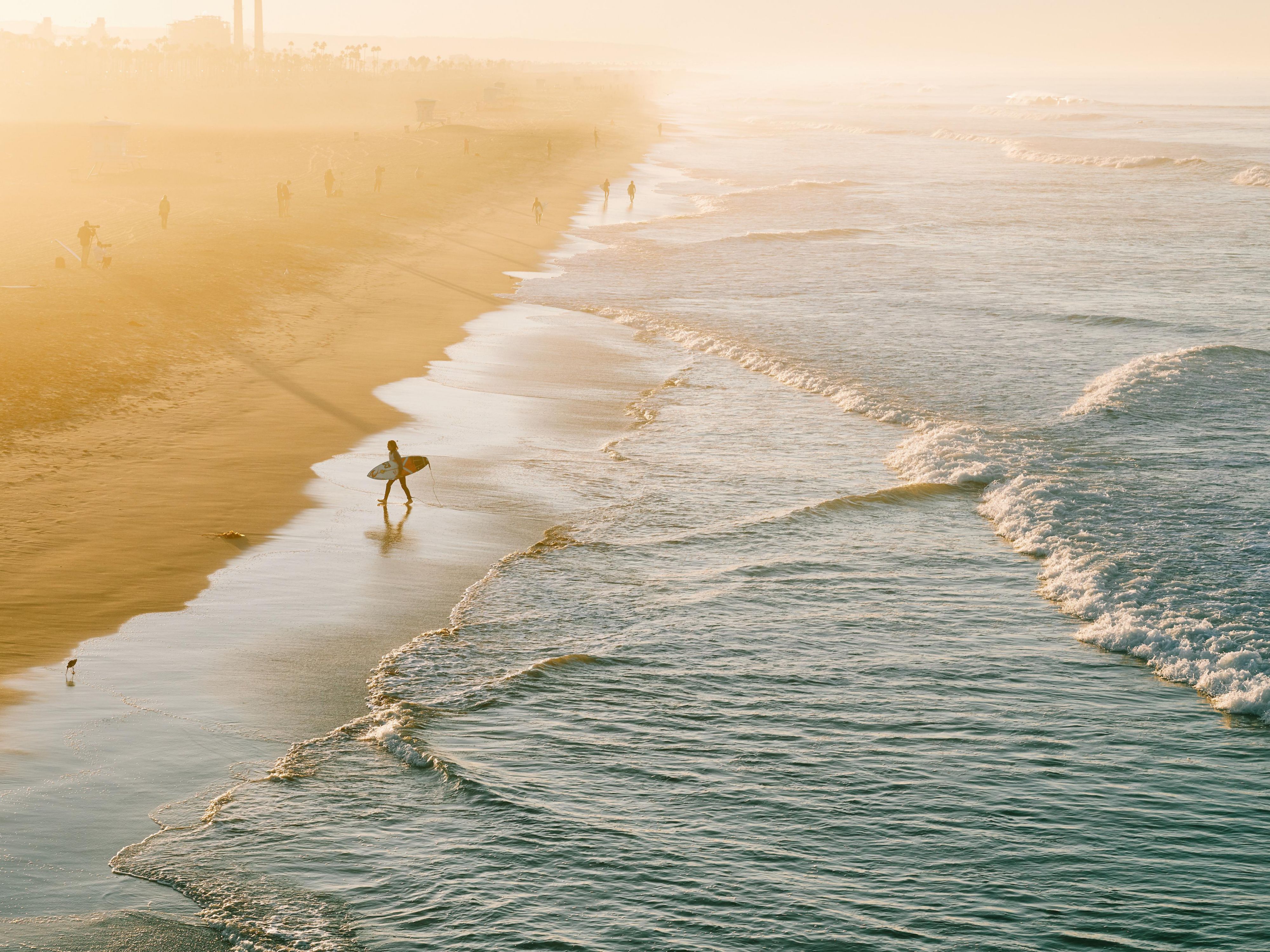 Surfer with surf board on the beach