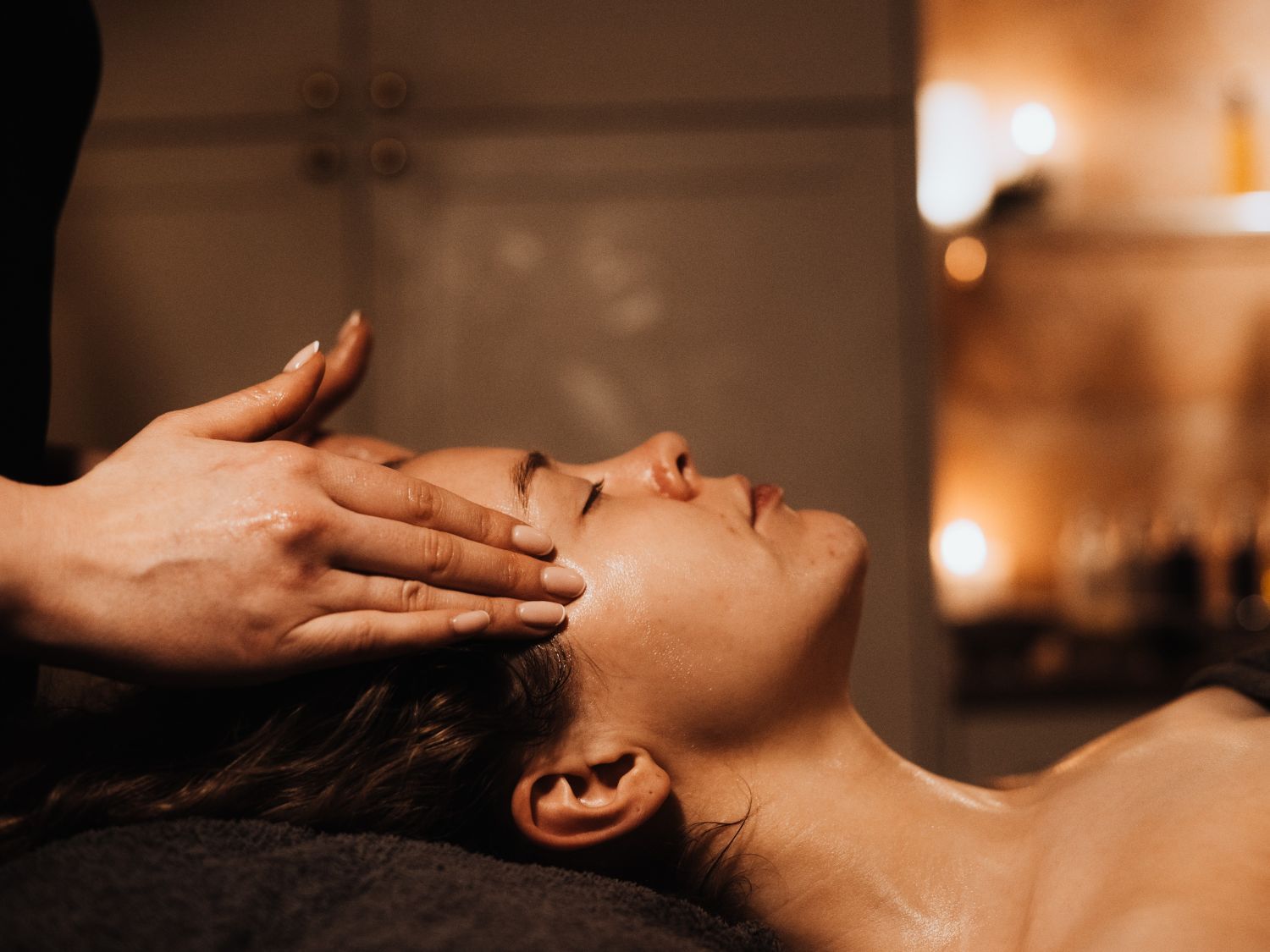 facial for woman in a spa treatment room