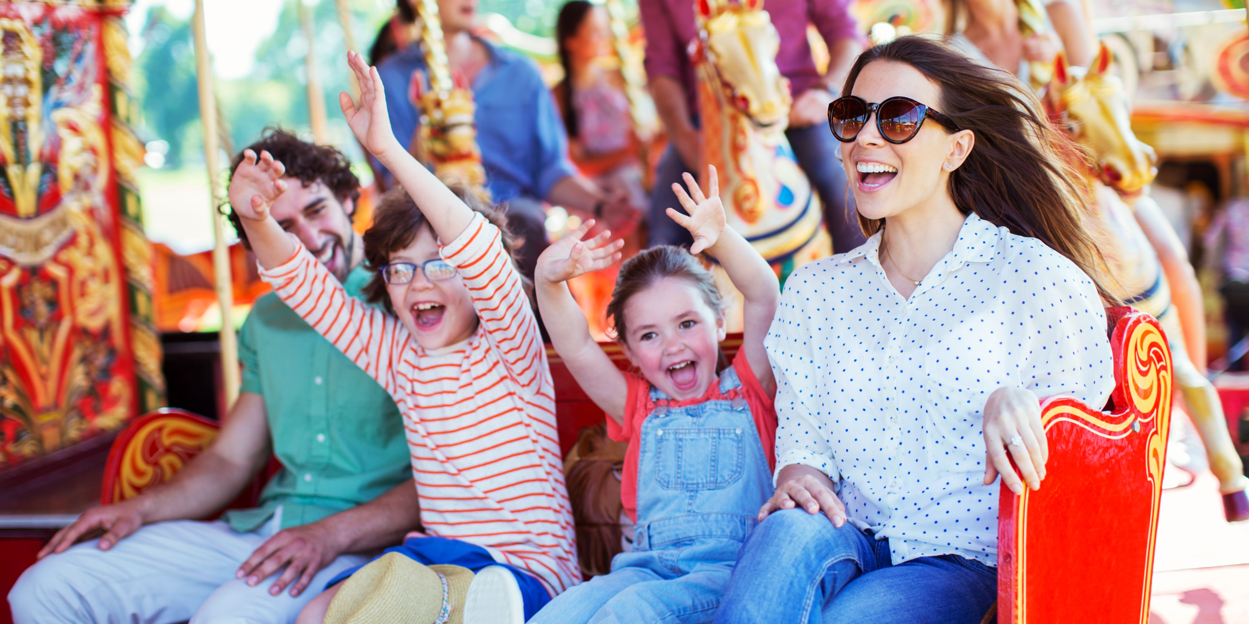 Family on a ride at a theme park.