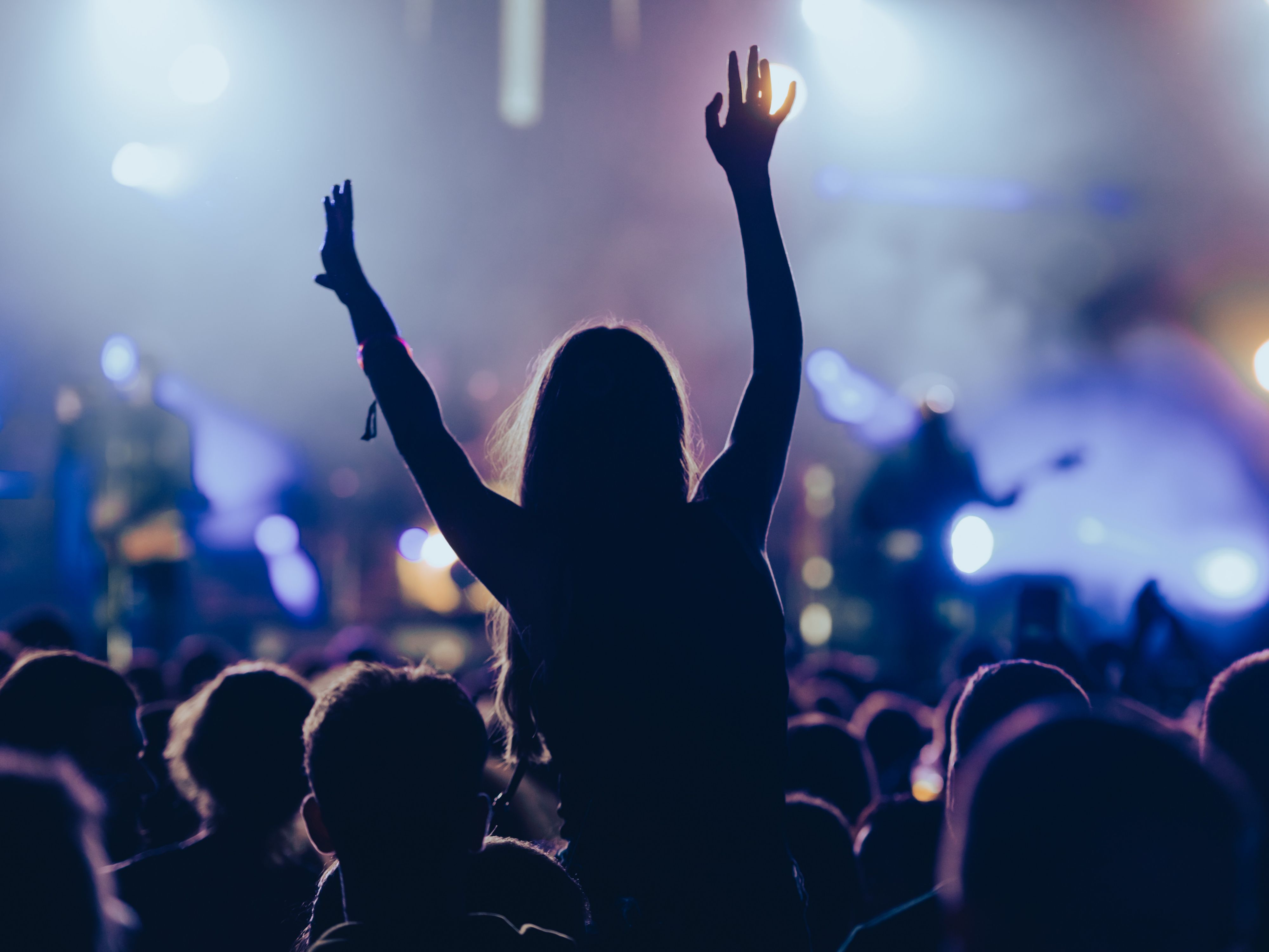 Fan enjoying a concert at Climate Pledge Arena