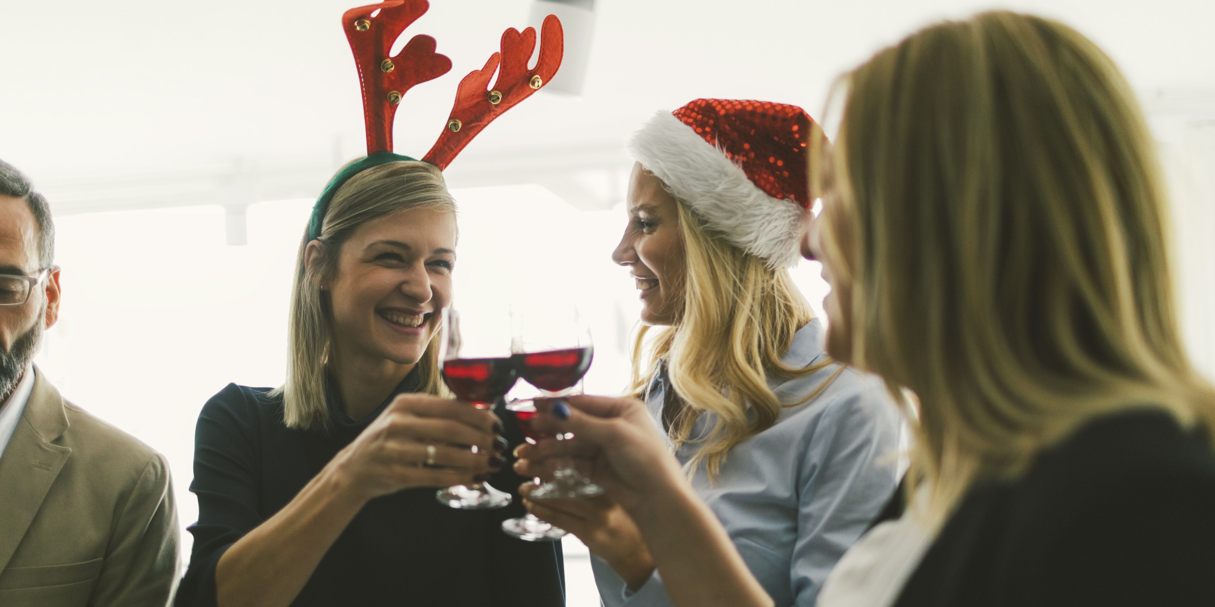 Cheersing with wine dressed up festively for event