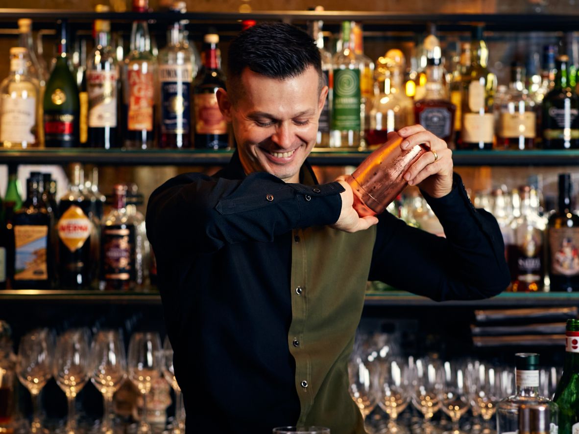 Bar staff making drinks