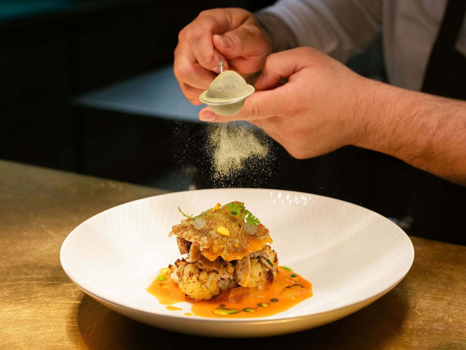 chef preparing dish at lazuli