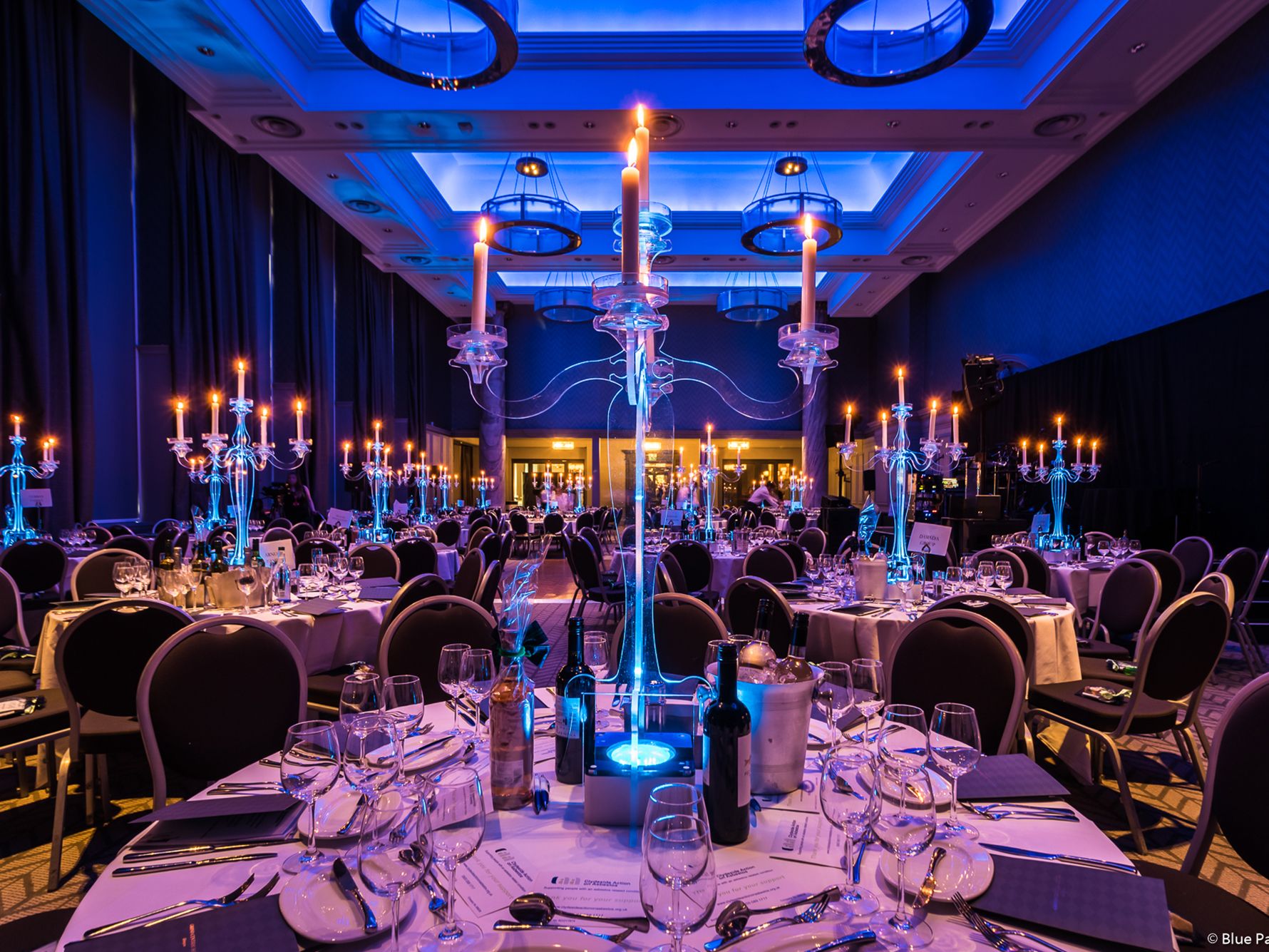 Banquet room set up for a black tie event