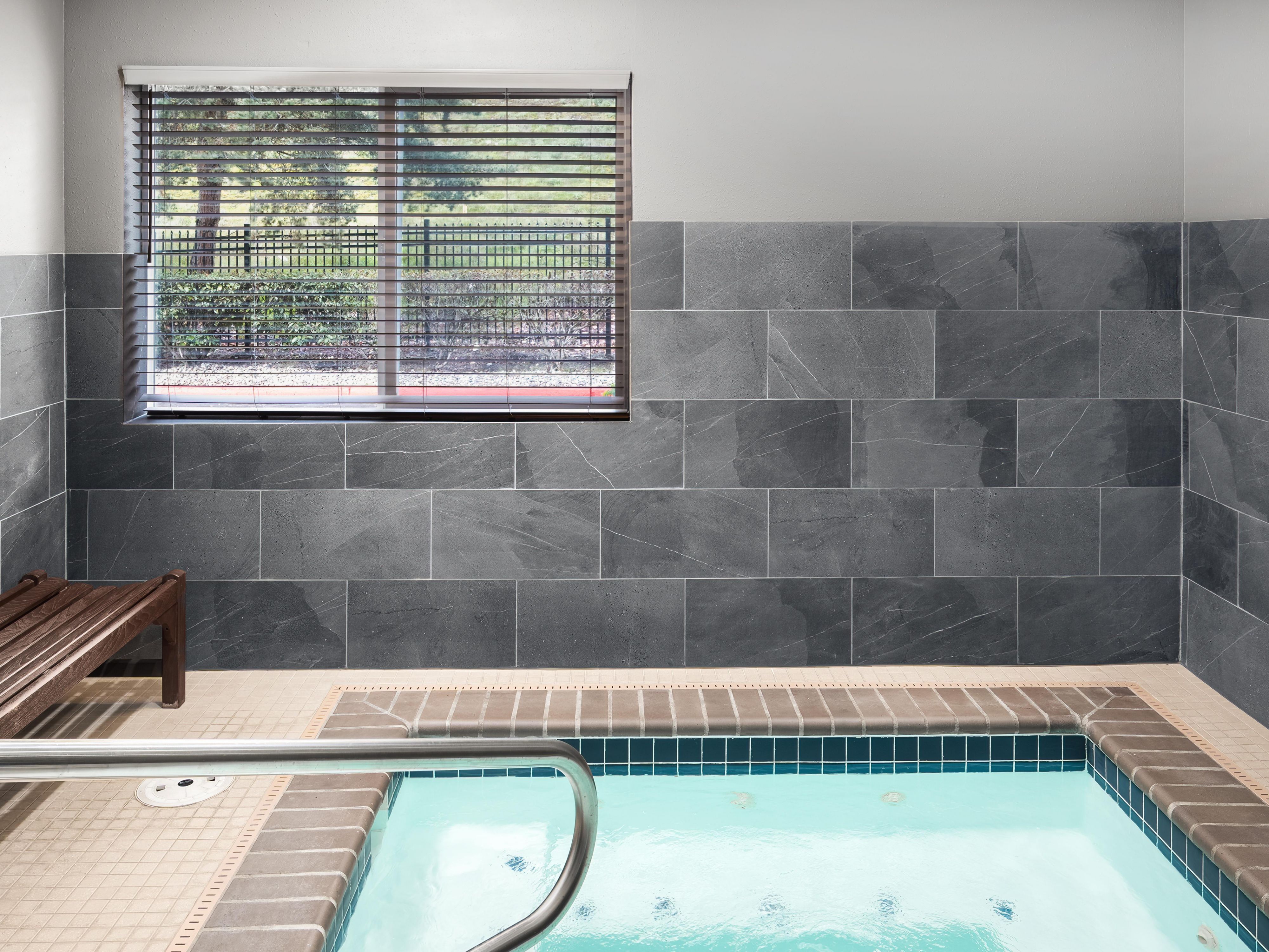Relax in our hot tub after a long day of travel. 