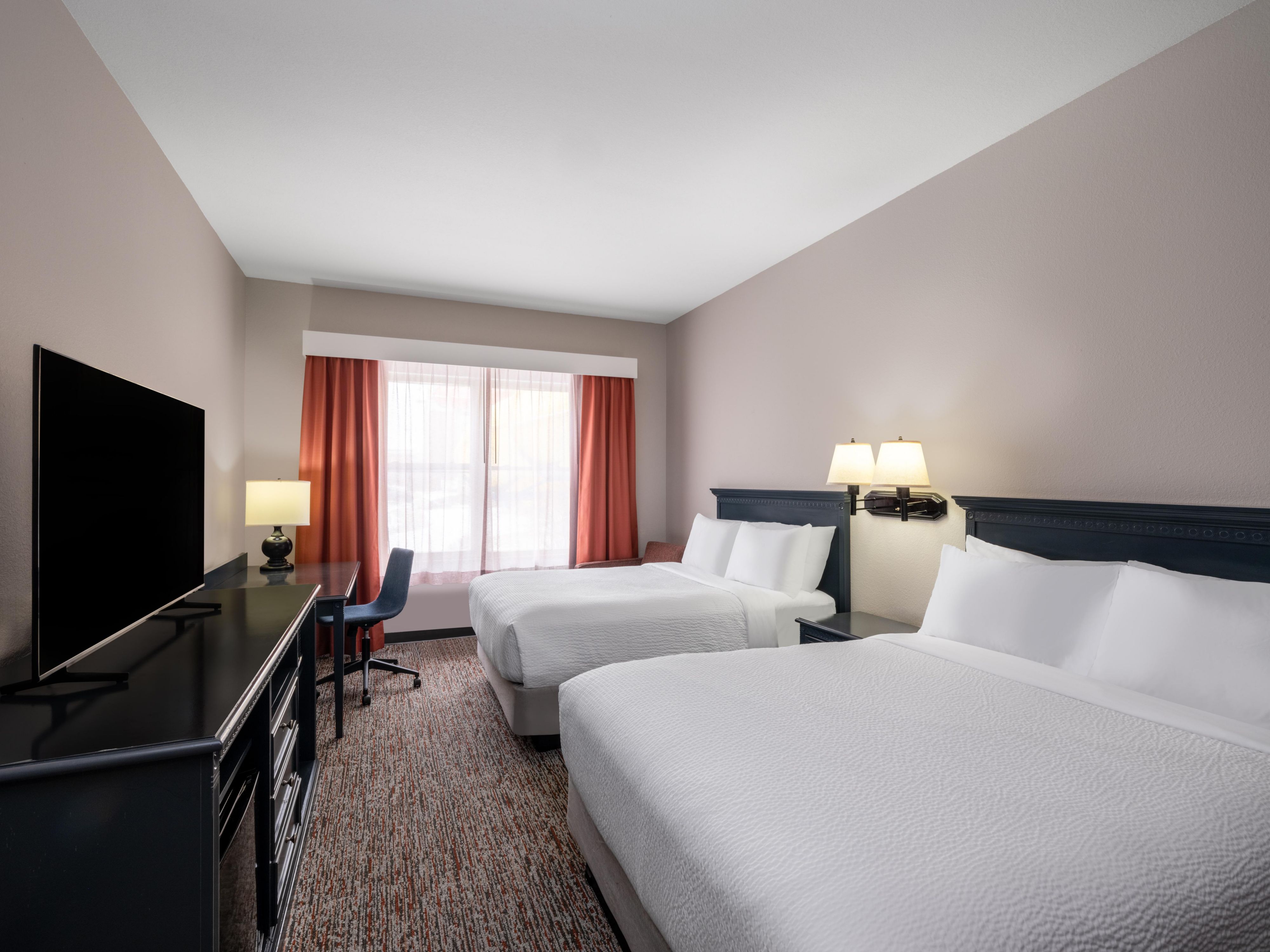 Our room featuring two queen beds is ideal for trips with friends.