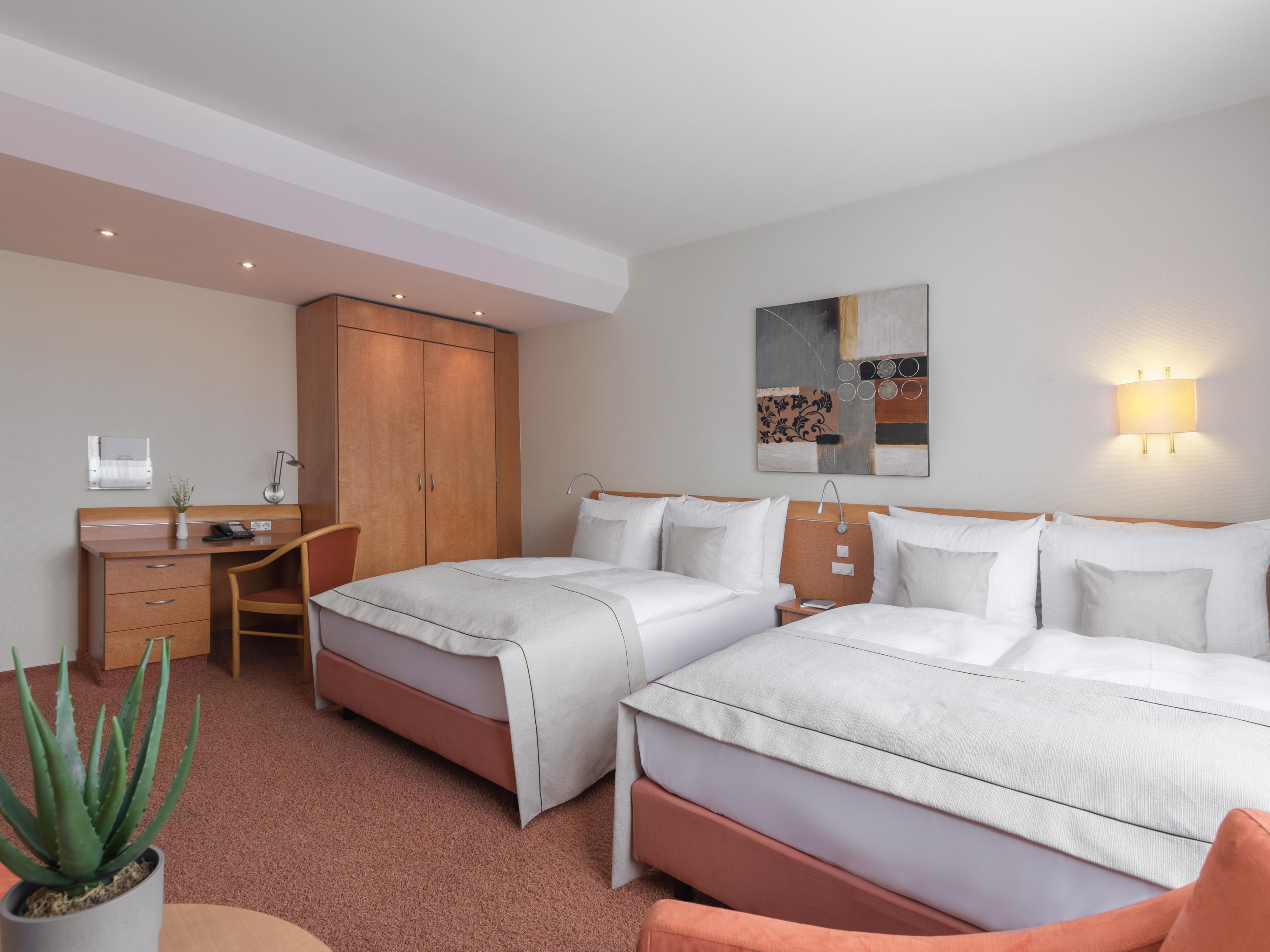 Our two double bed rooms offer the perfect blend of space and comfort, ideal for up to 4 guests or couples who enjoy their own space. Each room comes with a coffee capsule machine, refilled daily, so you can start your day with a fresh cup of coffee in bed. Whether you're traveling with friends or as a couple, enjoy the spaciousness and convenience
