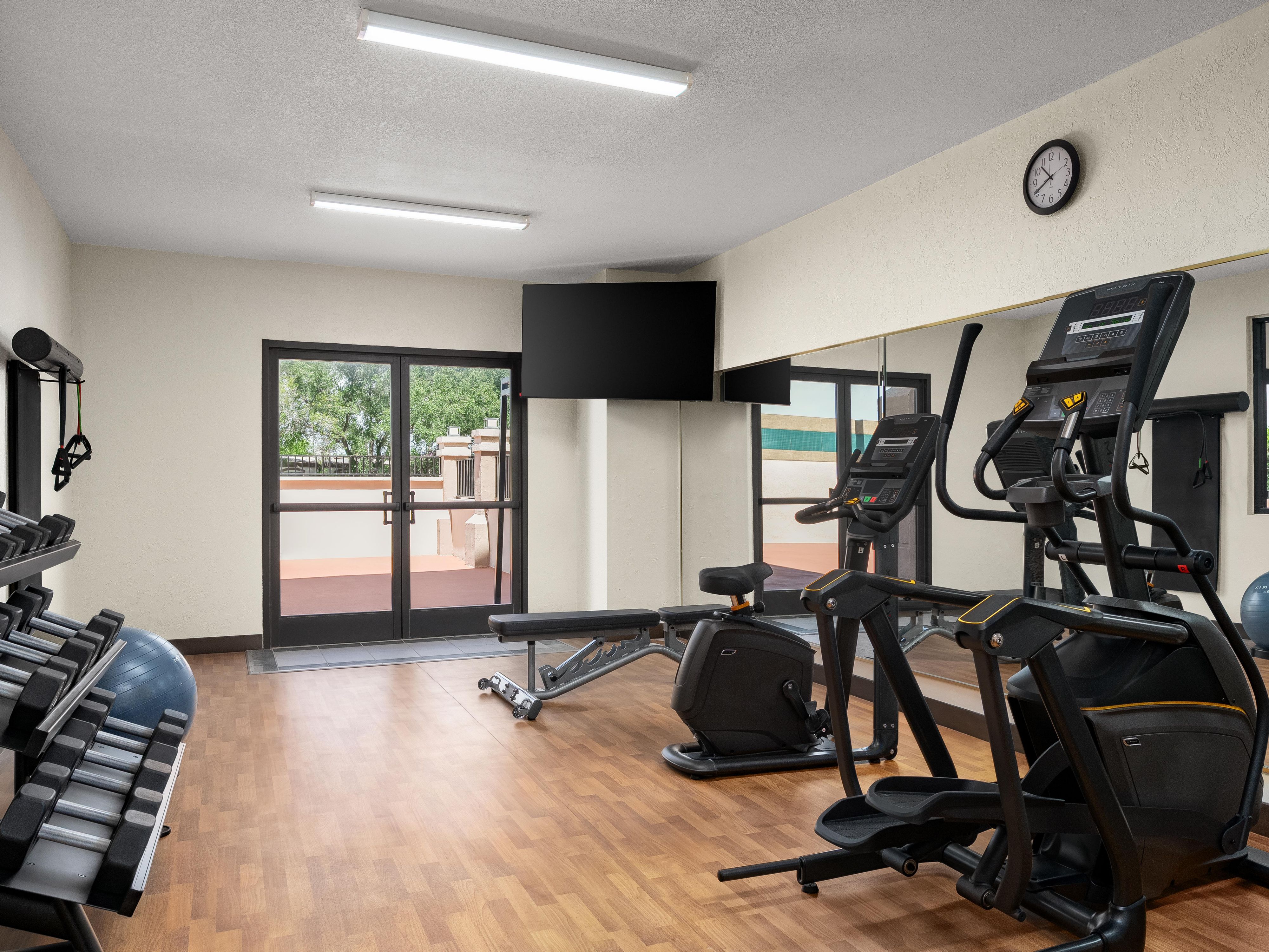 Fitness center with cardio & weights at our La Porte hotel.