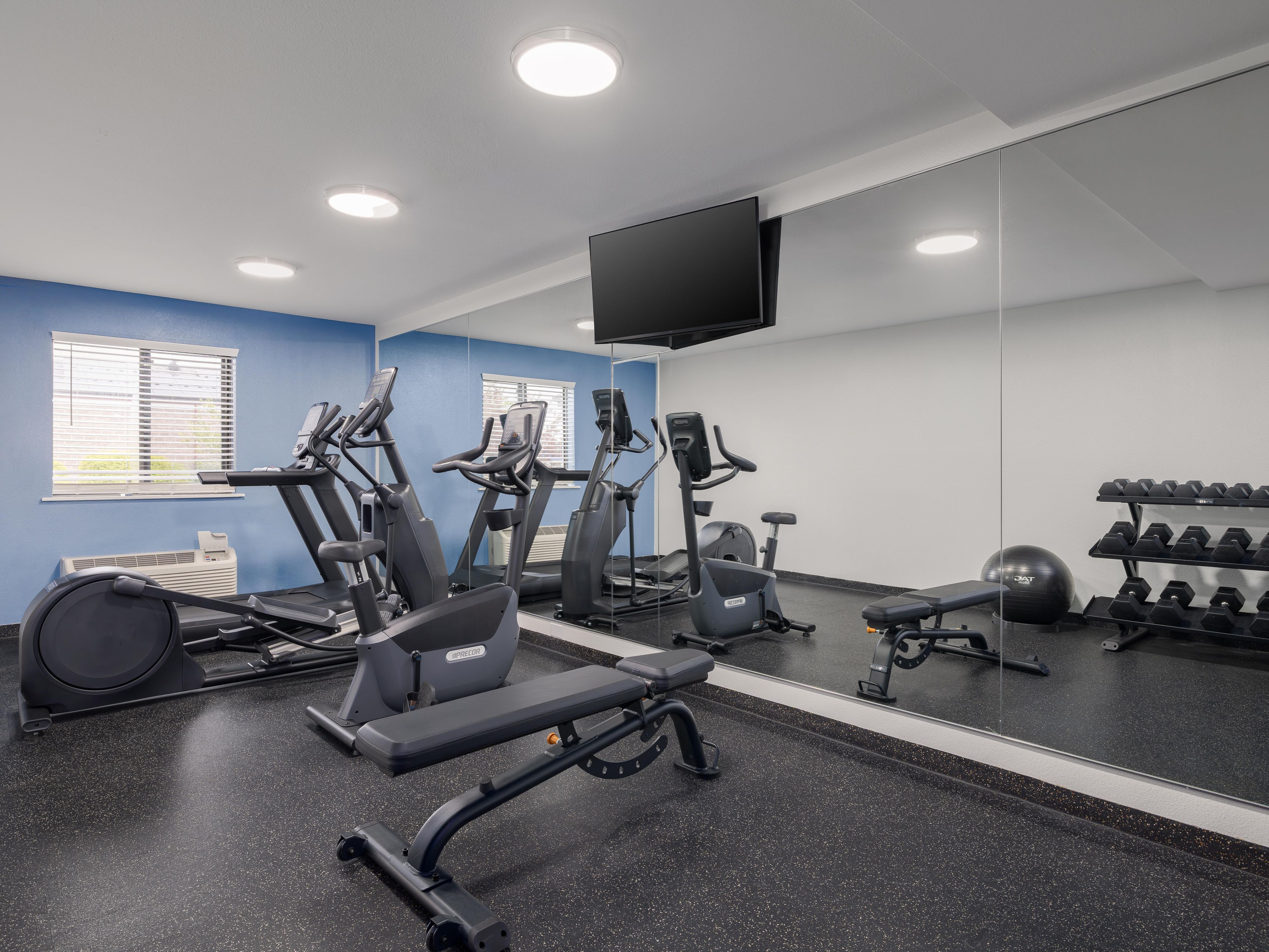 Guest fitness room with weights and exercise machines