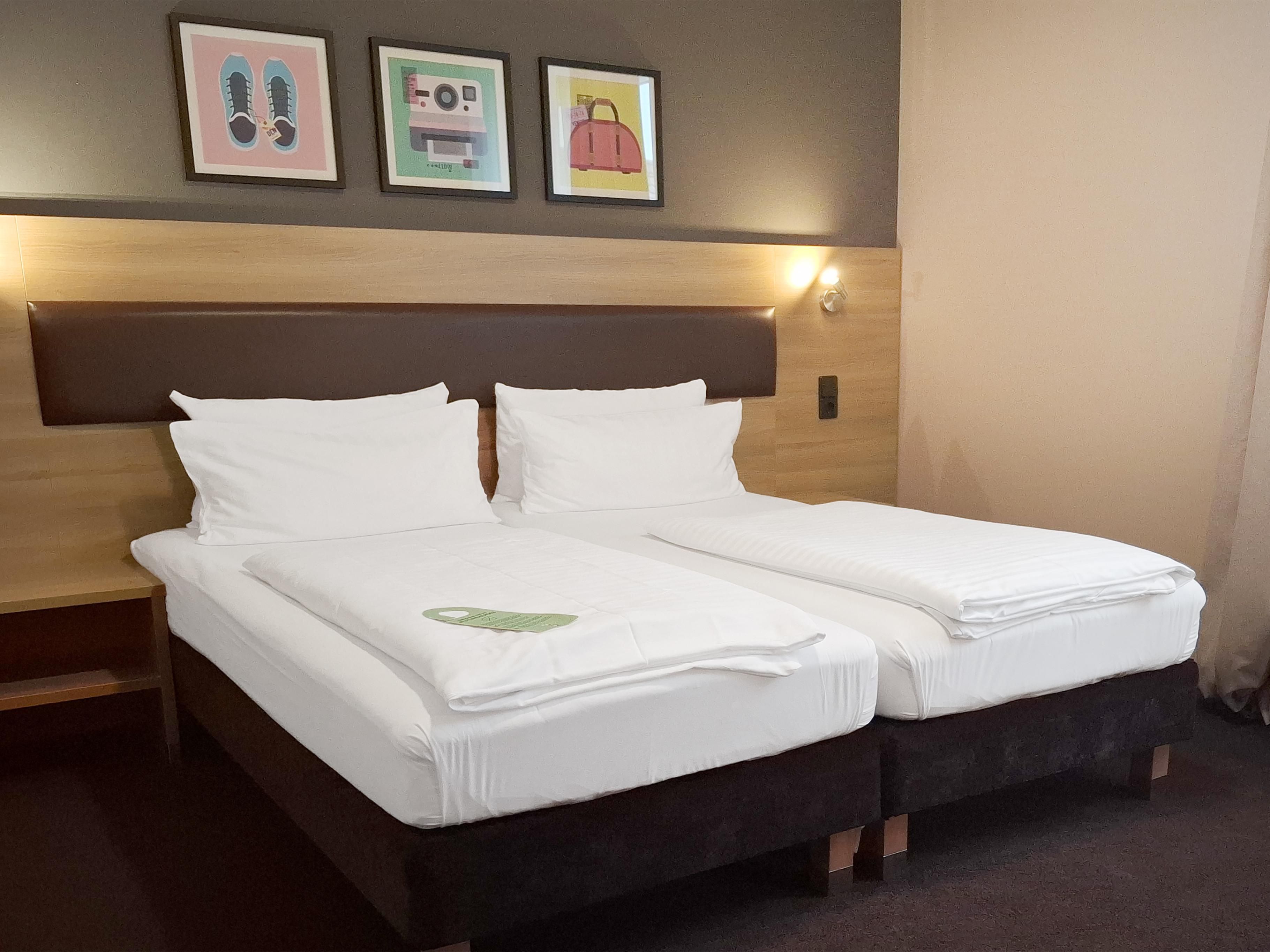 Bright standard room with two comfortable beds
