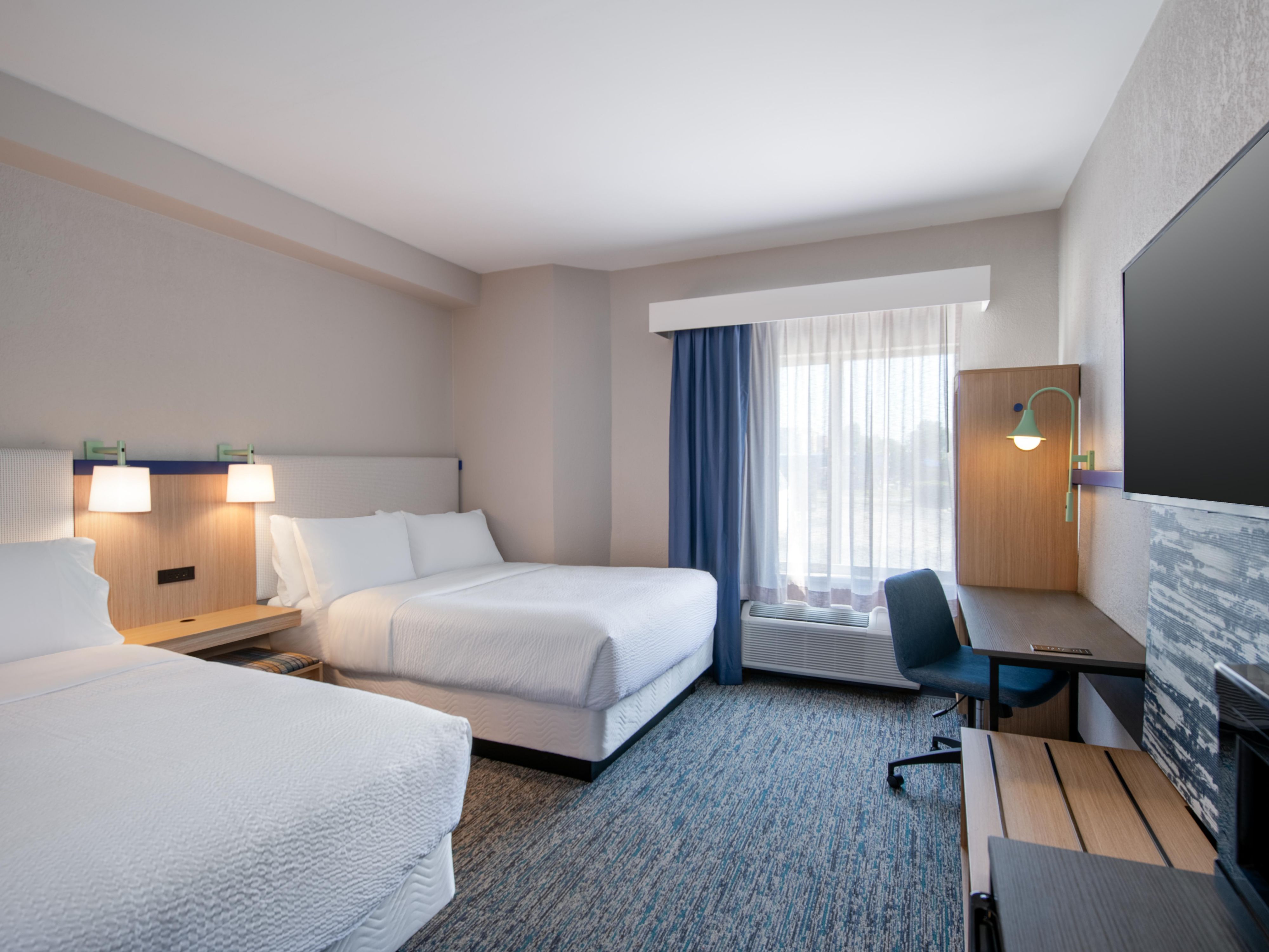 Relax together with two comfy queen beds