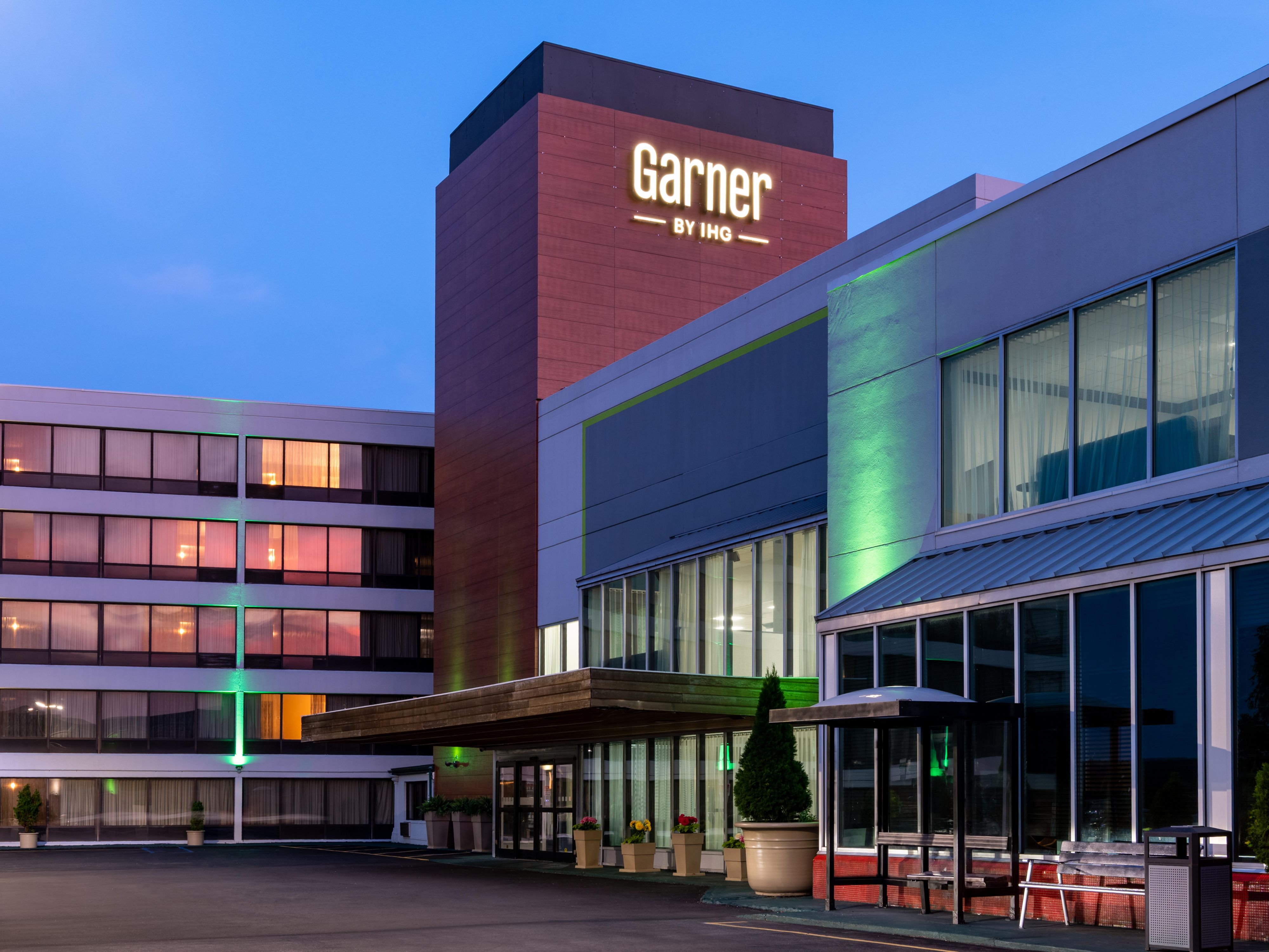 Exterior view of hotel at dusk.